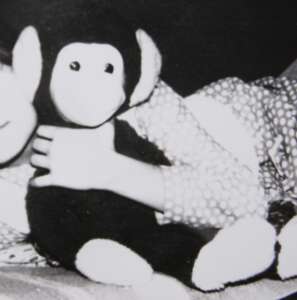 The family's old black-and-white photo of Ika, the lost childhood monkey toy our replica was made from