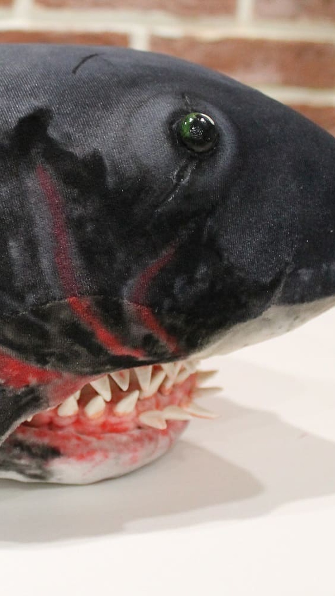 Jaws shark plush with gill slits, painted scars and a glass eye, a custom soft toy replica made to order