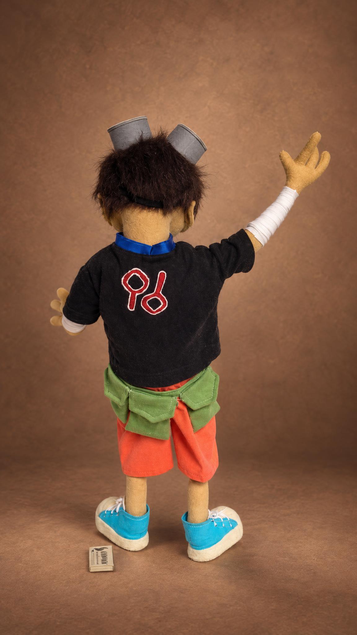 Kuro doll from Tekkonkinkreet with the red print on his black T-shirt, a custom anime doll made to order