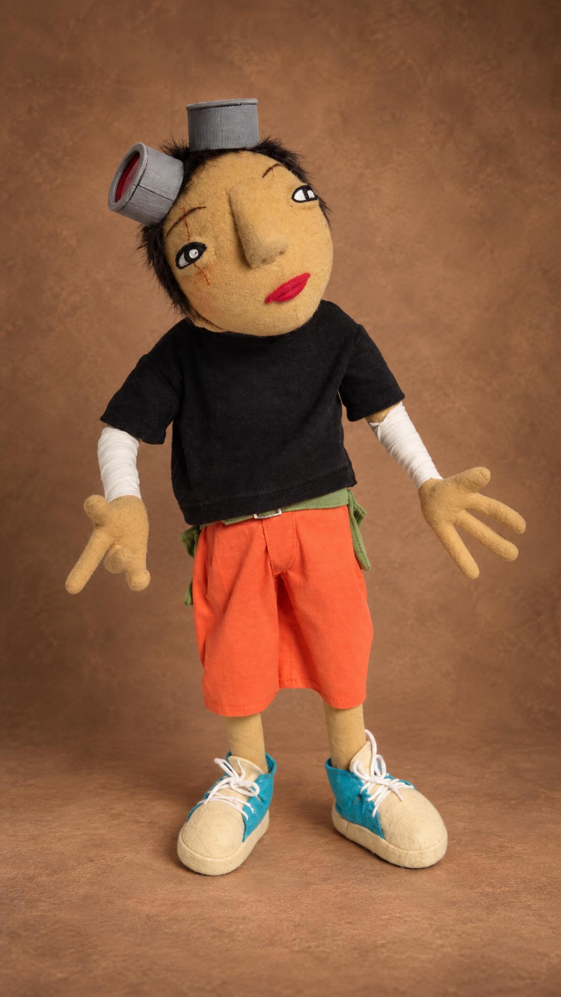 Handmade Kuro doll with a scar on his cheek and bandaged arms, a custom Tekkonkinkreet anime doll
