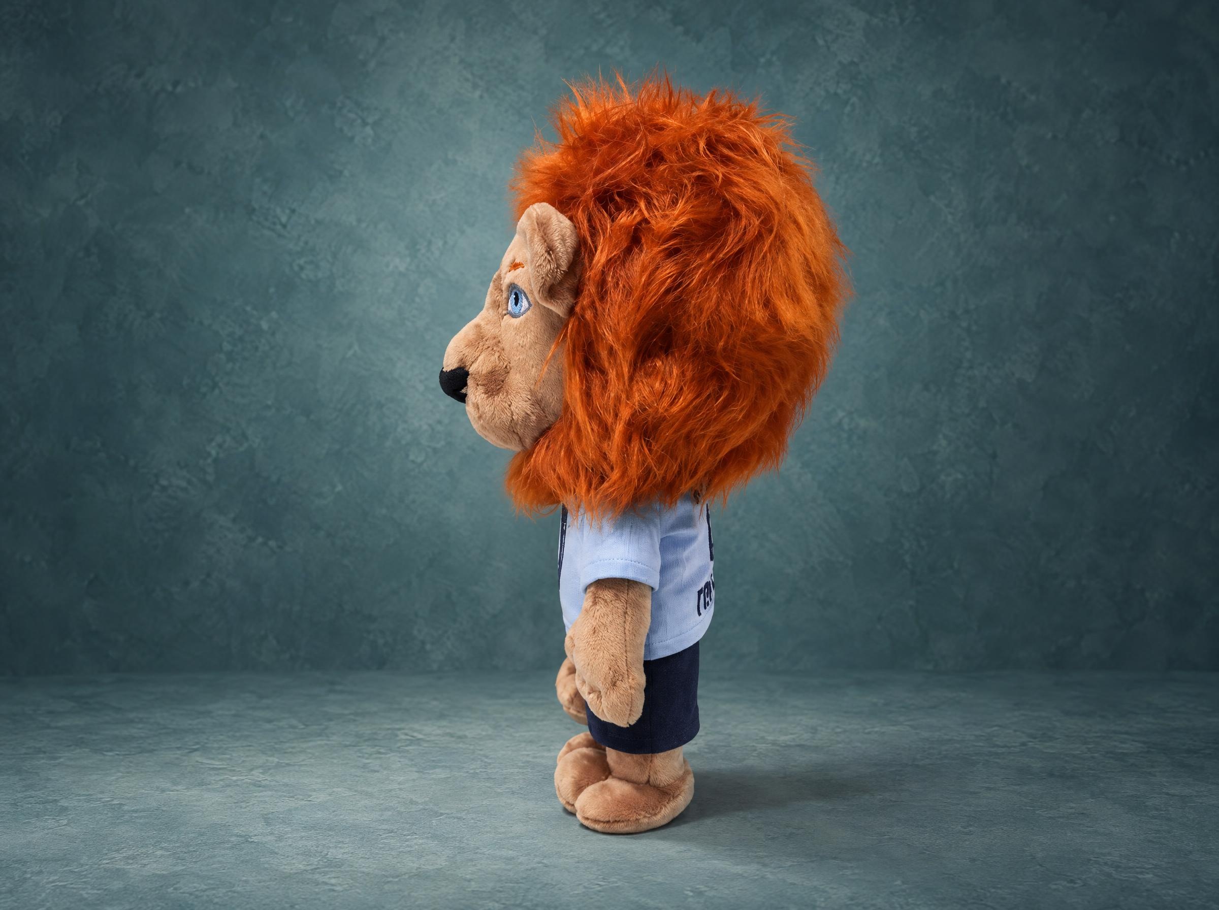 Lion mascot plush with a big shaggy orange faux-fur mane and tan minky muzzle, custom made for a football club