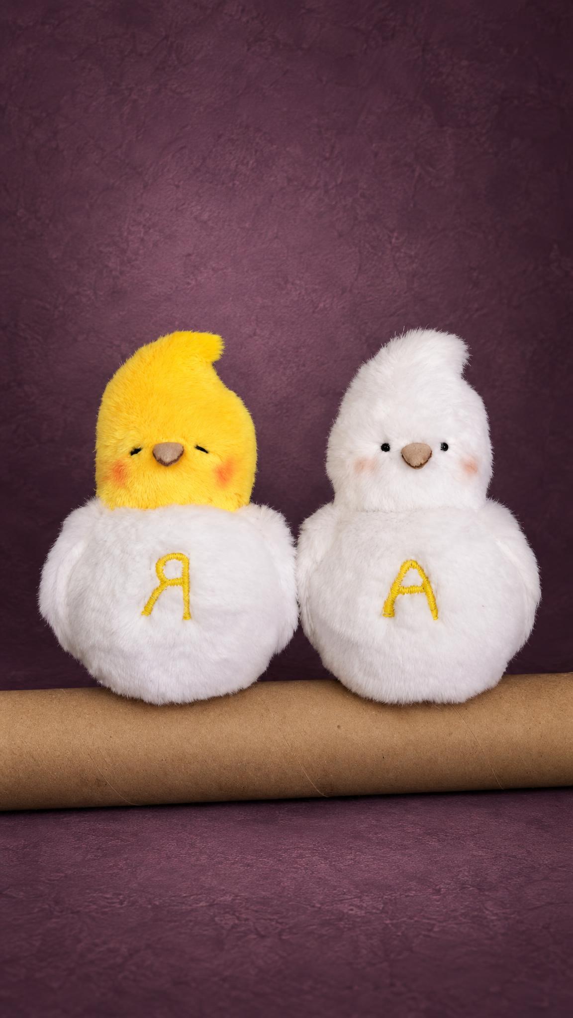Two Dove Plushies From Art, Handmade to Order Two dove plushies from art, handmade to order with pink cheeks and a yellow embroidered letter on each belly
