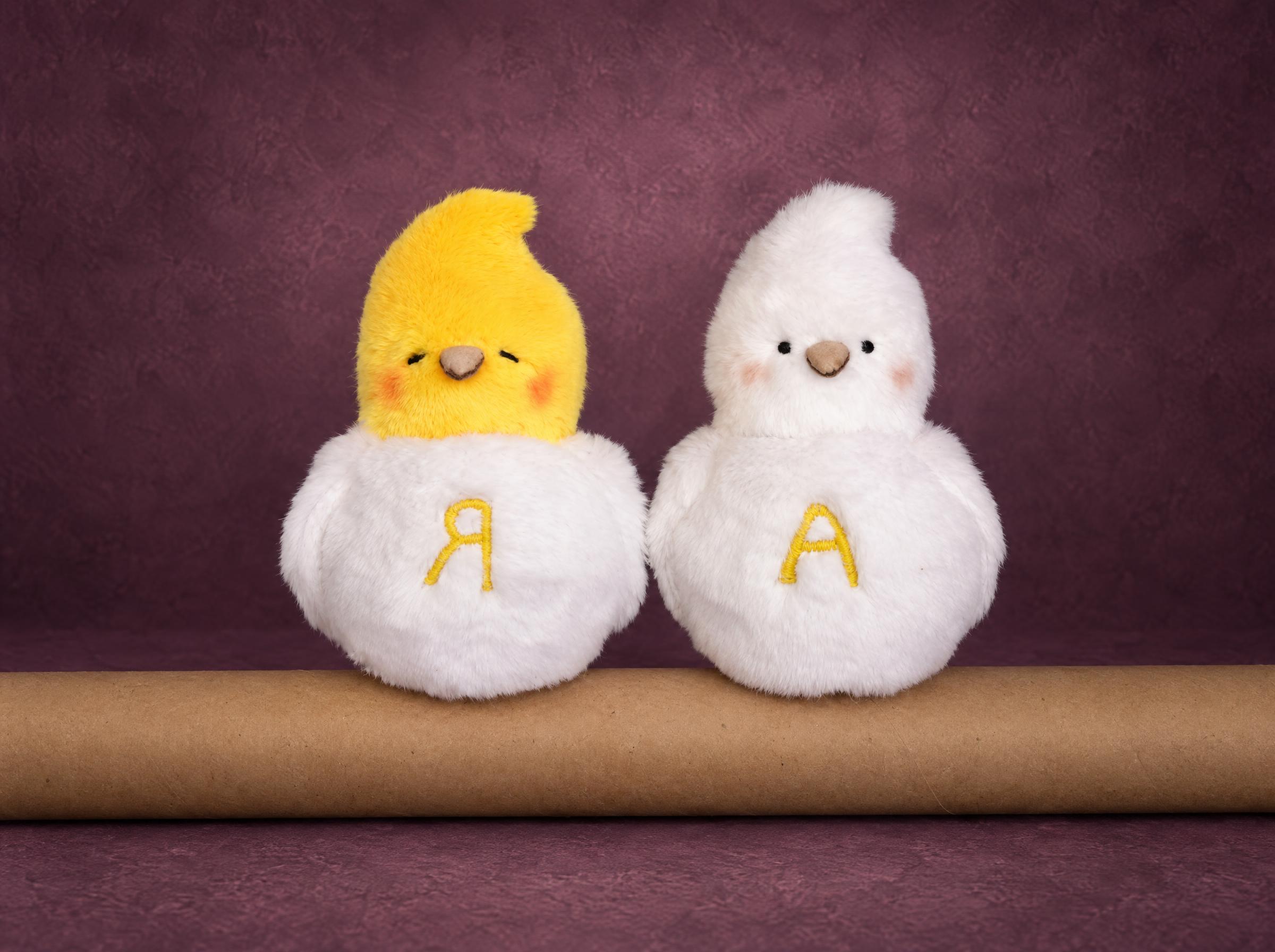 Love birds plush made to order: two white doves, one with a yellow head, sewn from a drawing as a gift for her