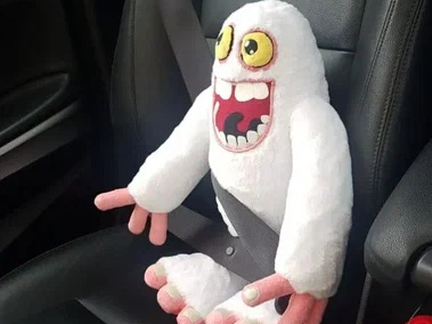 Handmade Mammott plush buckled into a car seat Handmade Mammott plush buckled into a car seat with a seatbelt, a custom My Singing Monsters toy made to order