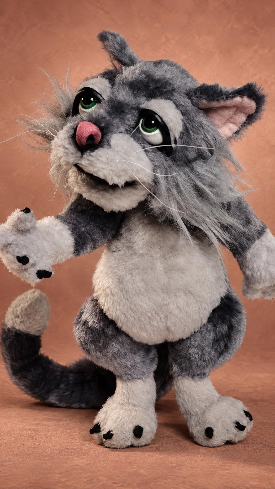 Marion the cat plush with green eyes, wispy whiskers and grey faux fur, a Mongrels puppet toy made to order