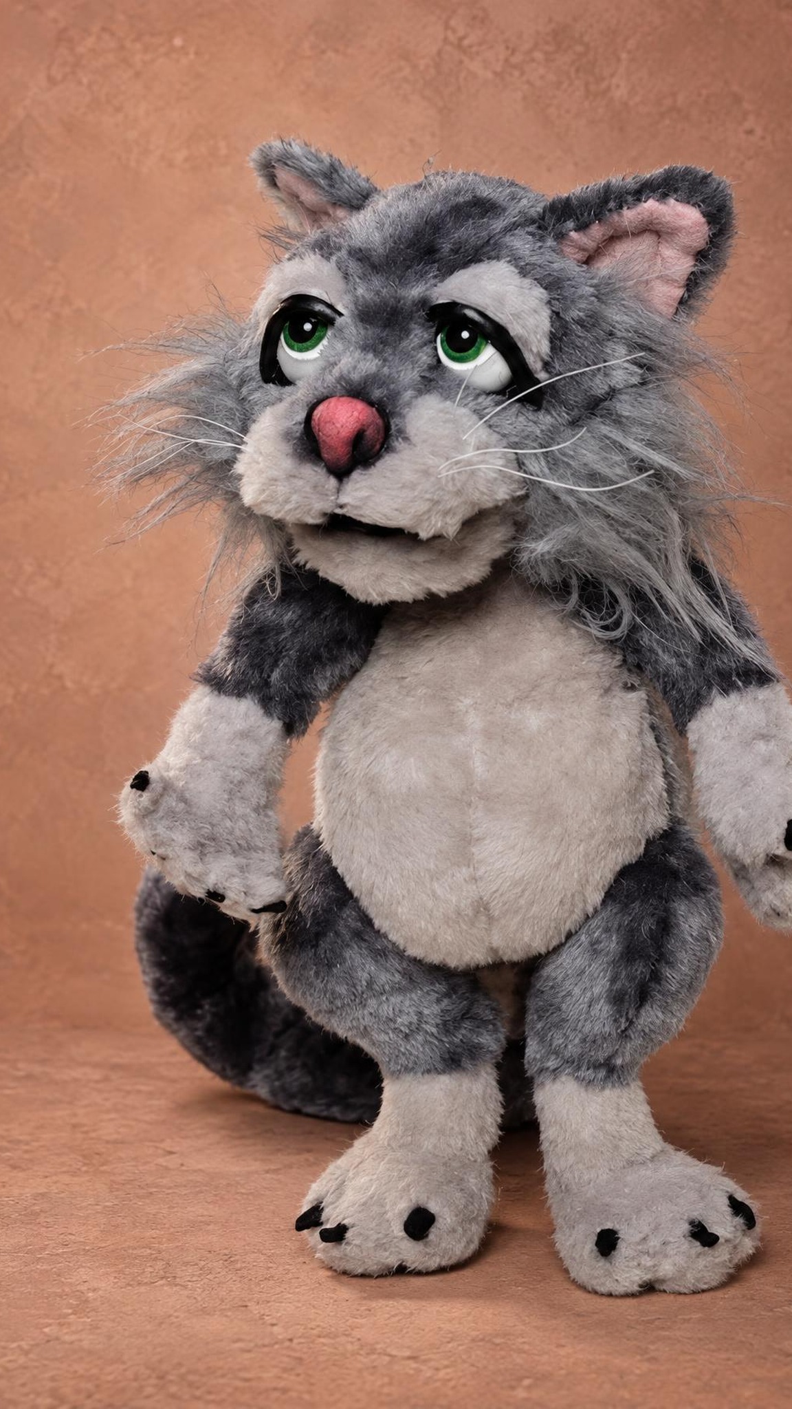 Marion the cat plush standing with a white belly and black felt claws, a Mongrels character sewn to order