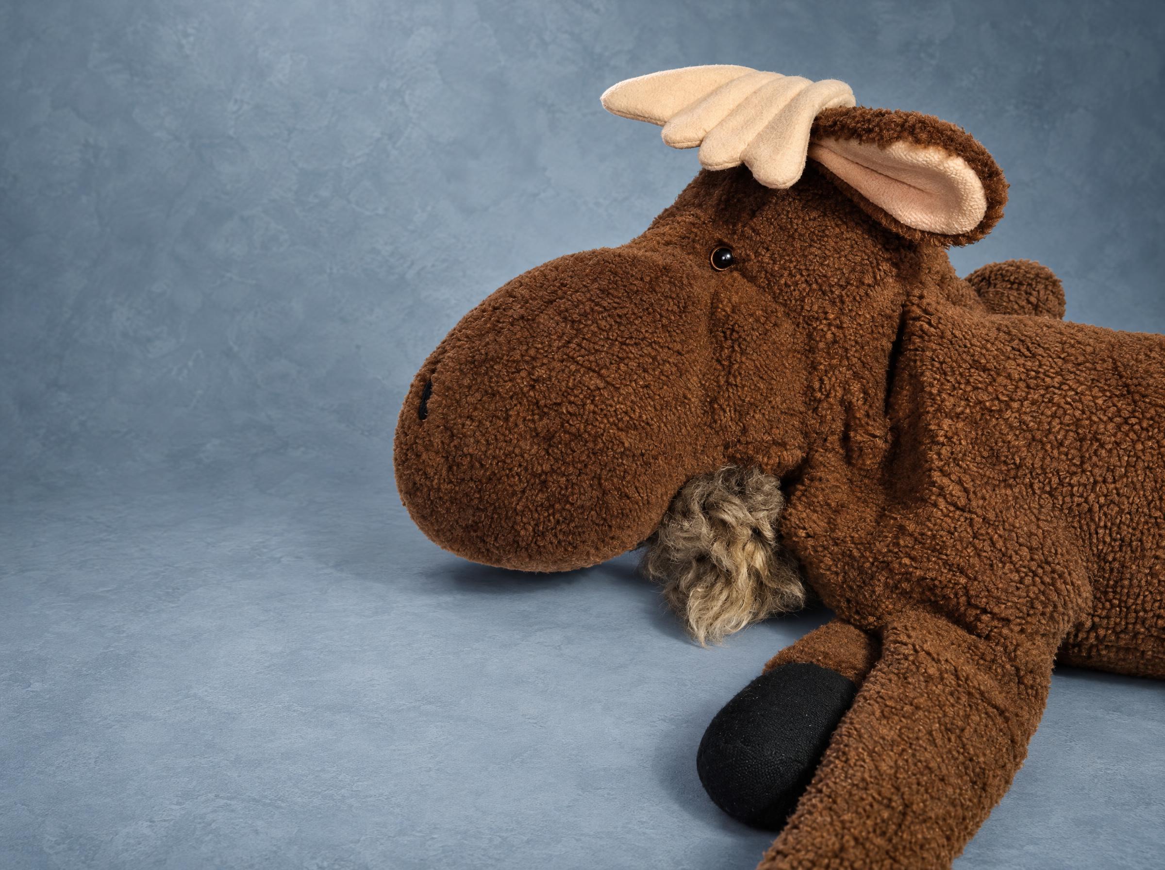Moose plush with the shaggy bell under its chin Custom moose plush with a shaggy fur bell under the chin, pink-lined ears and soft antlers, made to order