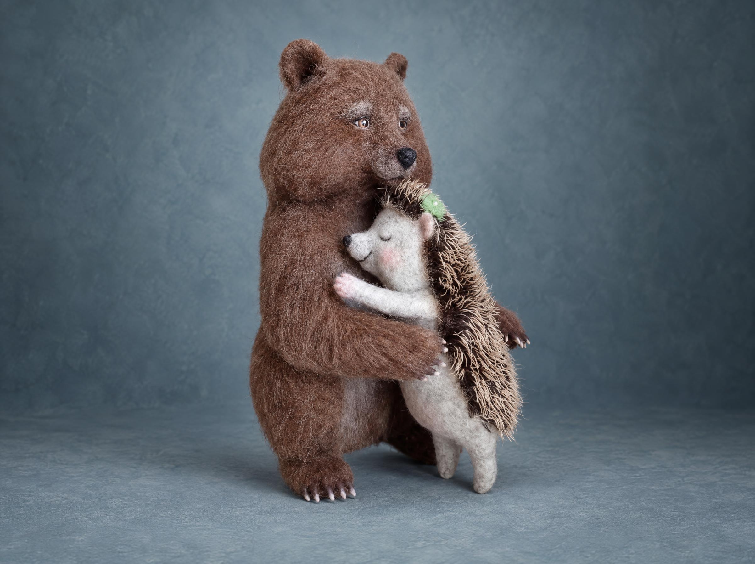 Needle felted bear and hedgehog made to order from a tattoo: a brown wool bear hugs a sleepy grey hedgehog