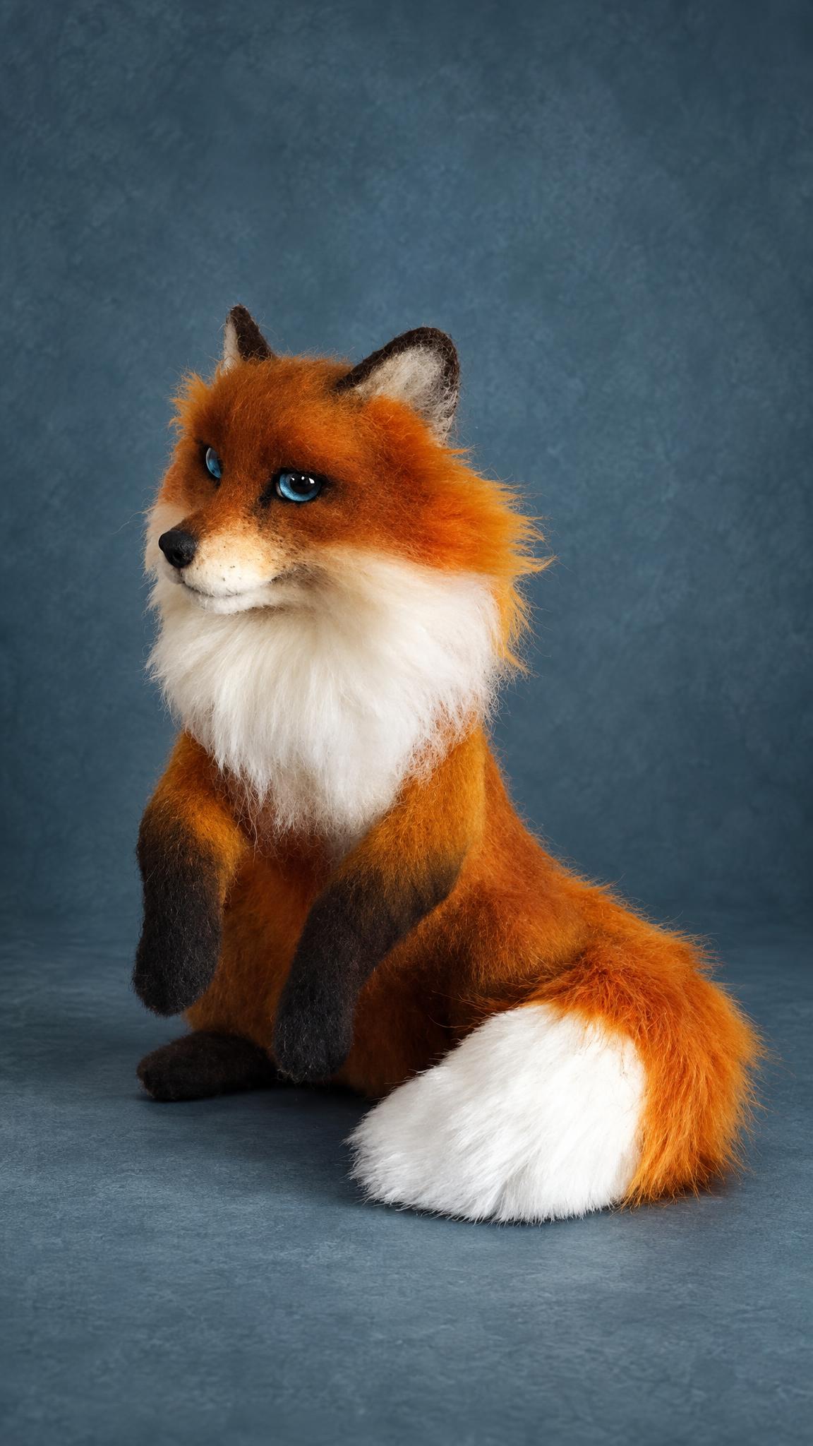 Needle felted red fox, a realistic stuffed animal made to order: dark stocking legs and a long bushy tail