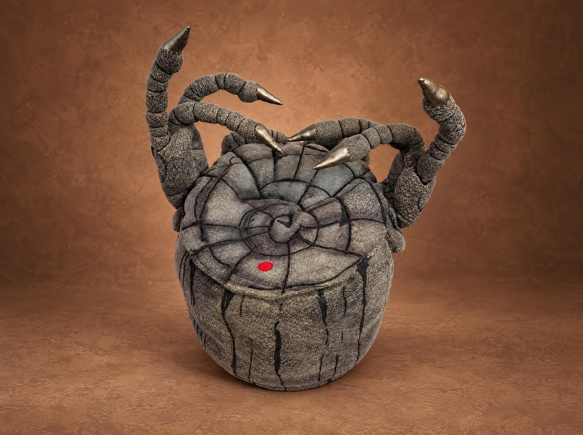 MSM Epic Noggin plush, stone drum with a spiral lid MSM Epic Noggin plush with a spiral whorl on its stone drum lid and raised clawed arms, made to order