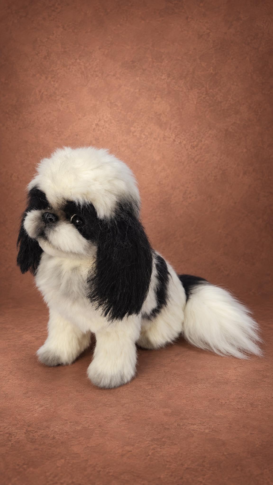 Custom Pekingese plush with a white plumed tail and long black ears, handmade from the owner's photos