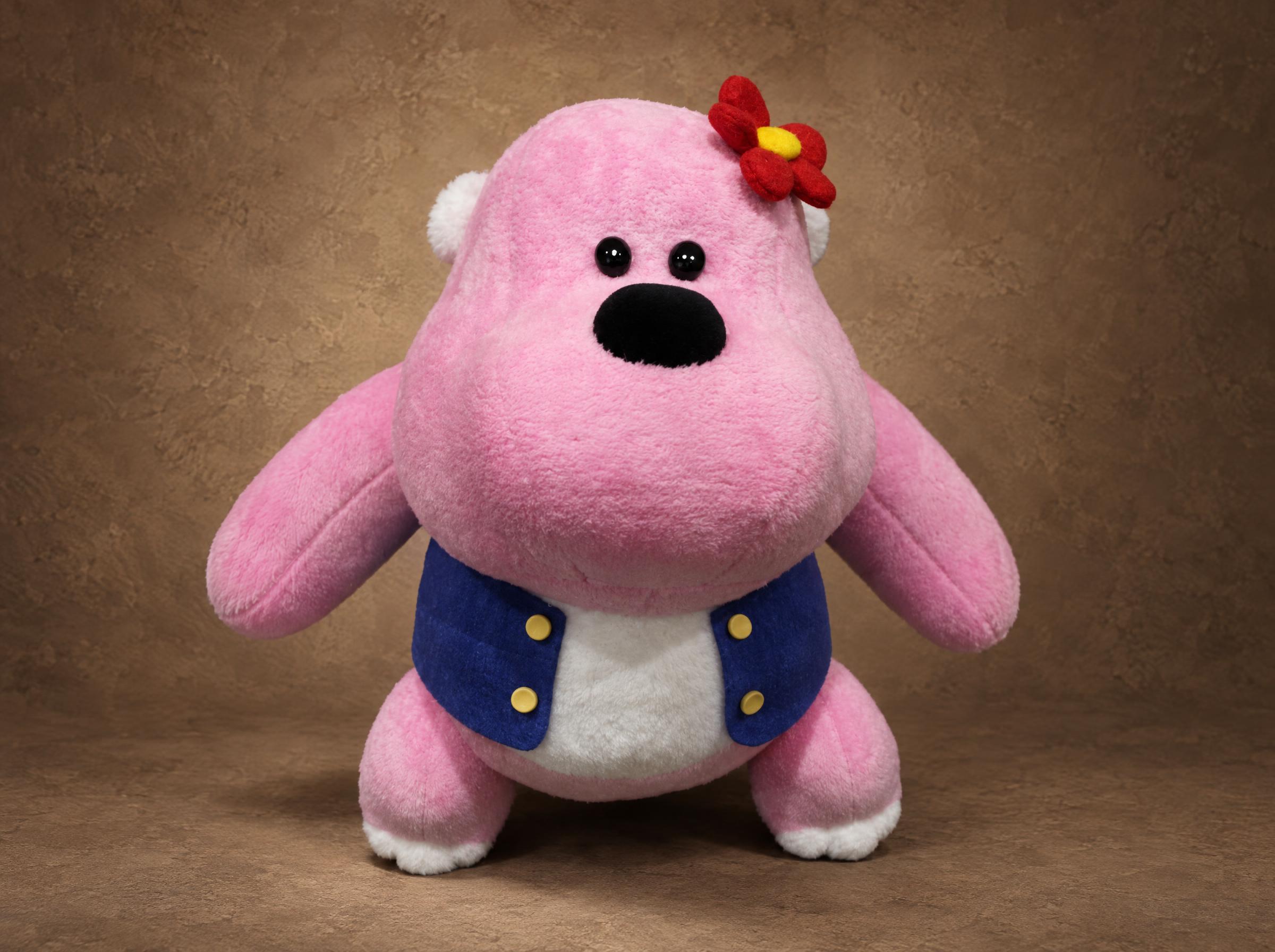 Lucy the pink gorilla mascot plush with a red flower and a blue vest, a company character sewn to order from 2D art