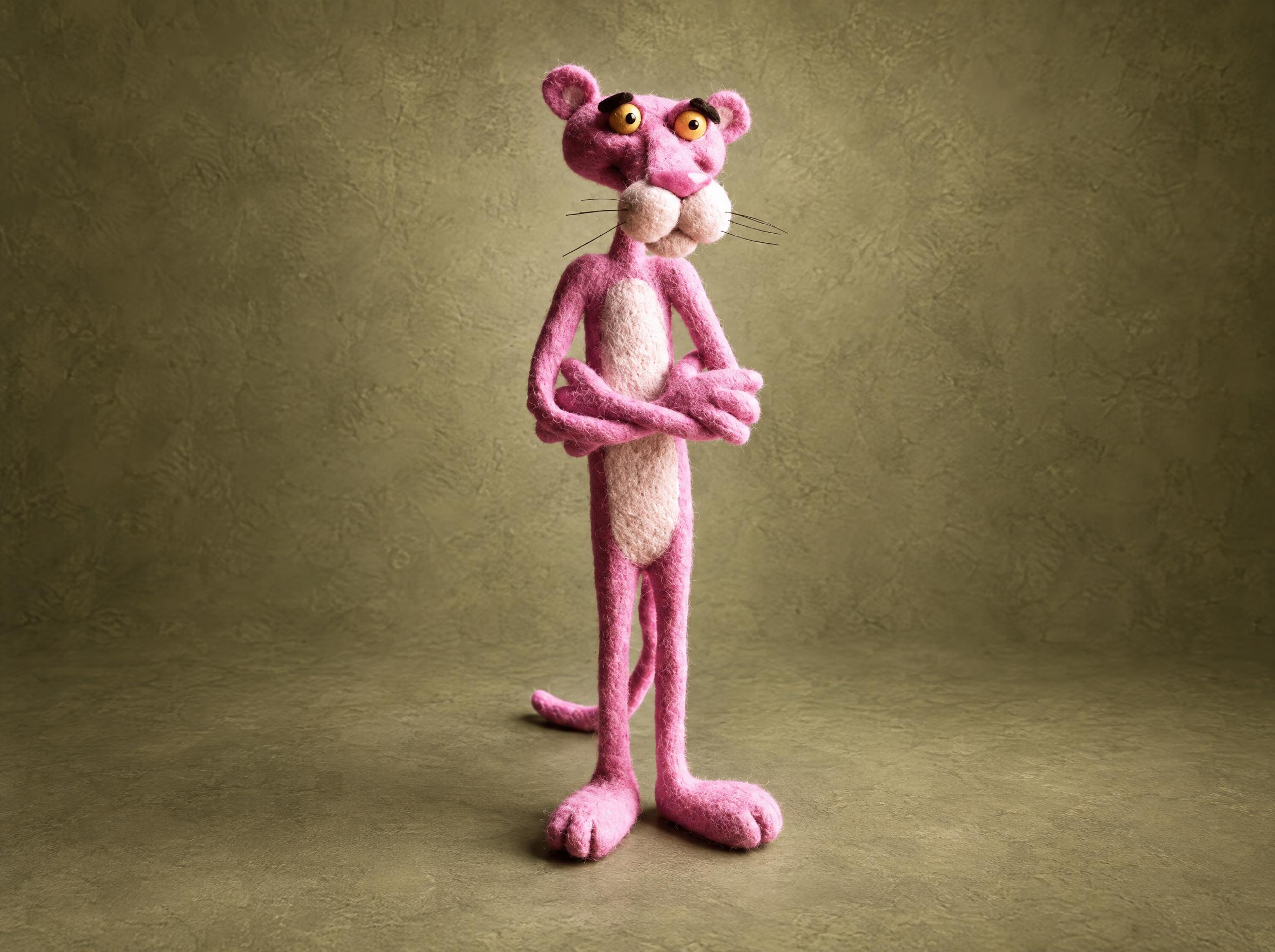 Pink Panther plush needle-felted from pink wool with yellow eyes and a long tail, made to order
