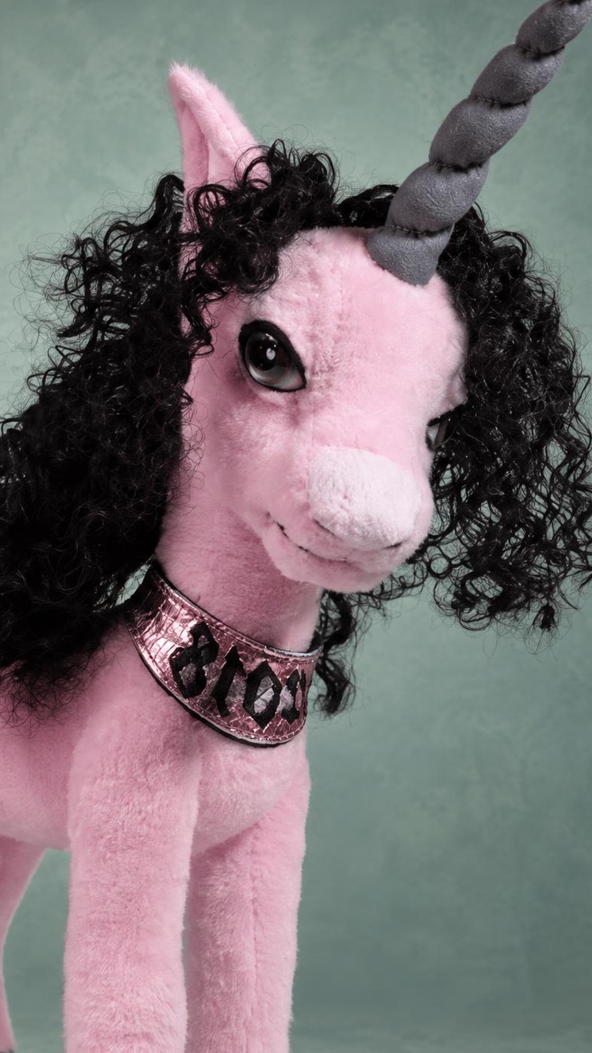 Pink unicorn plush with a lettered collar Pink unicorn plush with black curls and a shiny lettered collar, handmade to order for one customer