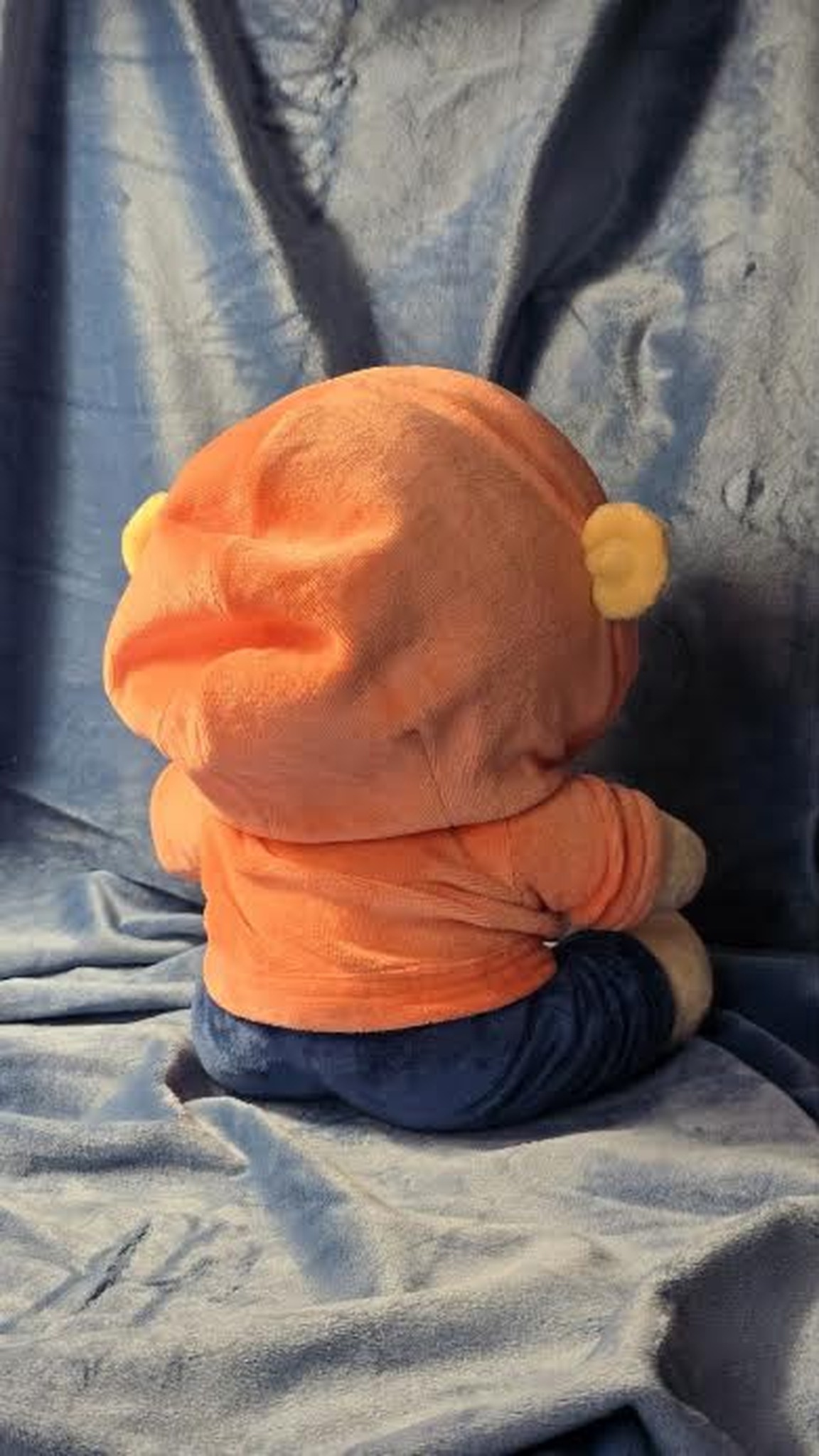 Plush portrait doll in an orange bear-ear hoodie and navy trousers, handmade to order for one person