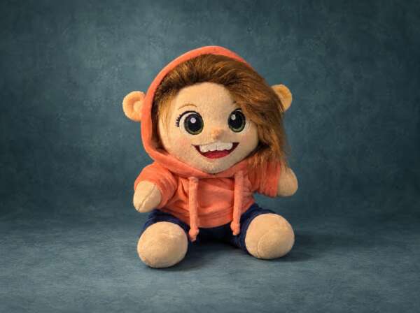 Plush portrait doll of a real girl in an orange bear-ear hoodie, handmade to order from photos