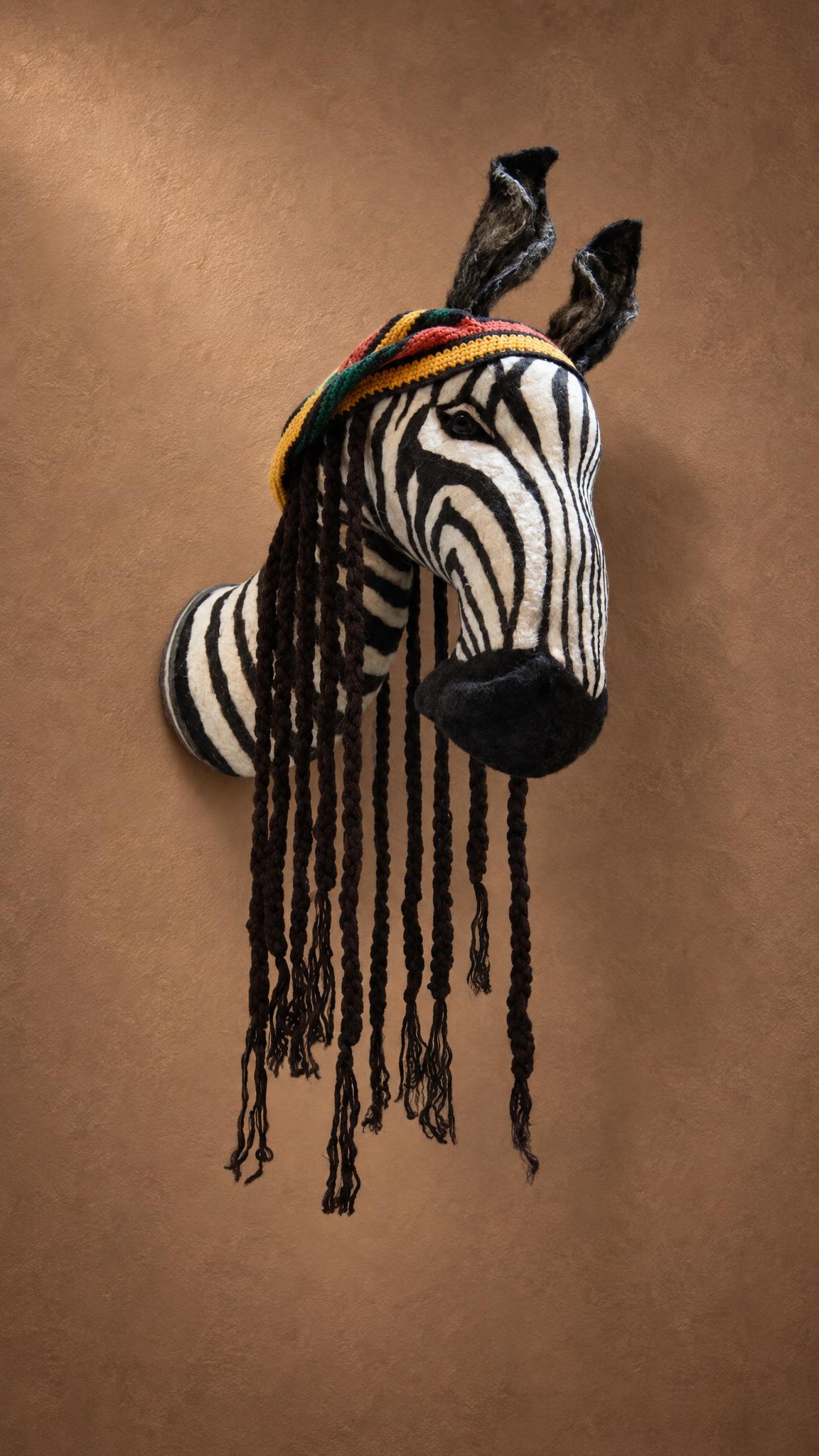 Plush zebra head wall mount, faux taxidermy made to order Plush zebra head wall mount, faux taxidermy made to order, with a red-yellow-green cap and yarn braids