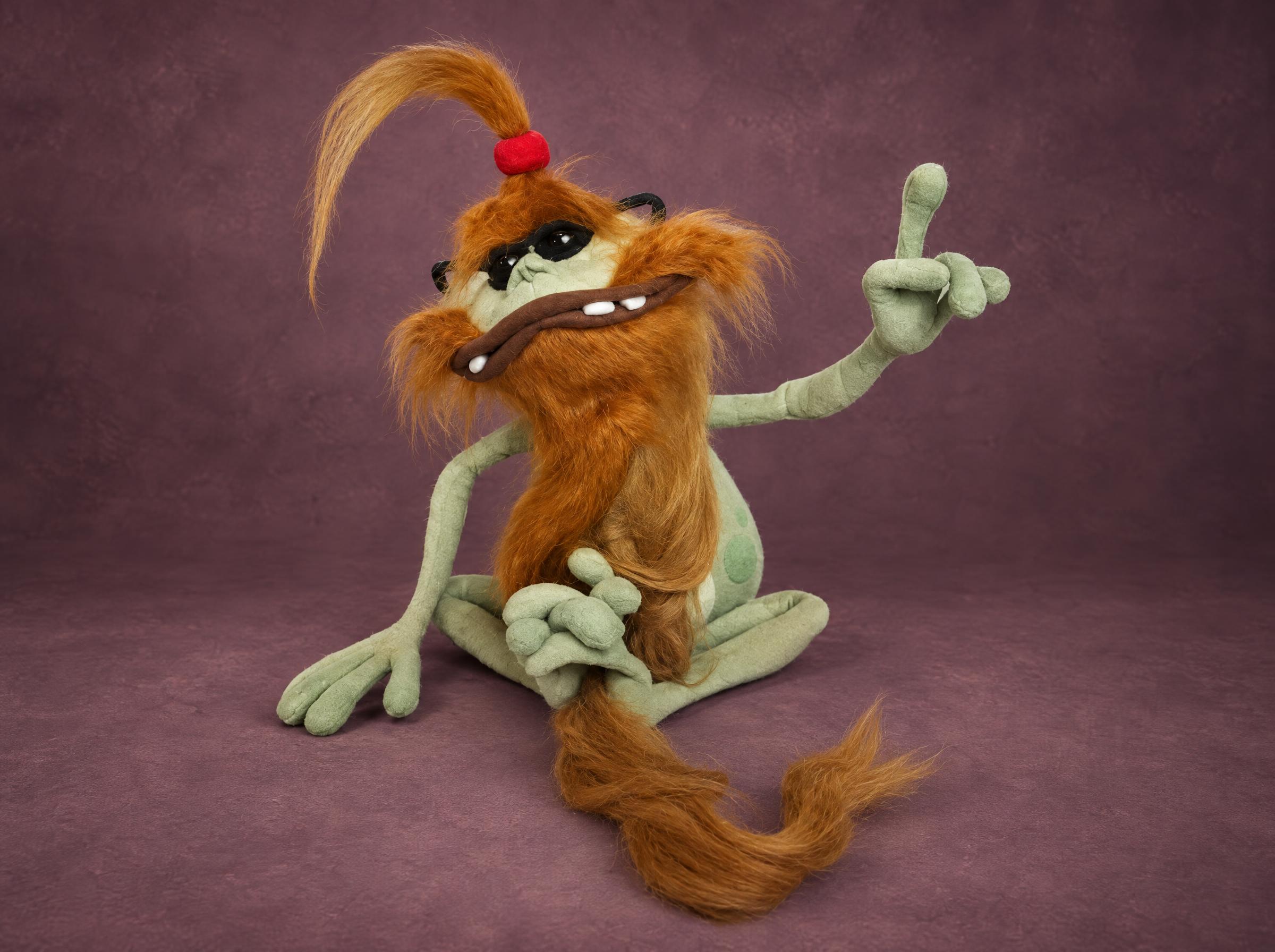 Polokus Plush with Ginger Beard Polokus plush from Rayman 2 with a long ginger faux-fur beard and tail and black sunglasses, a custom plush
