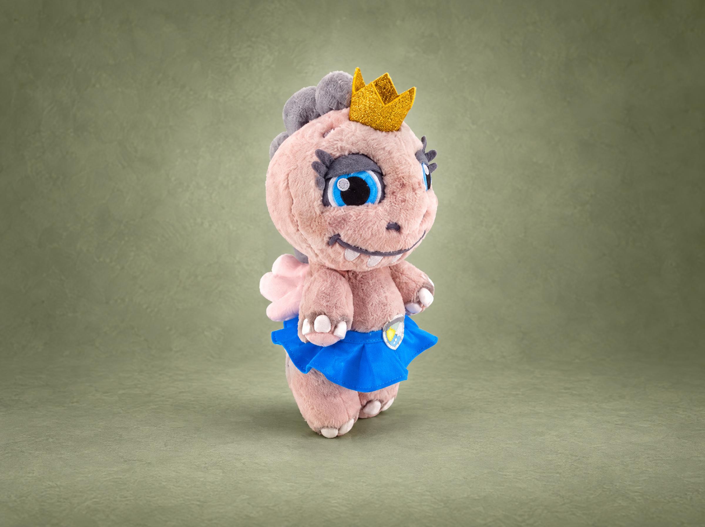 Princess dino plush with a gold glitter crown and blue tutu, handmade from a sticker design to order