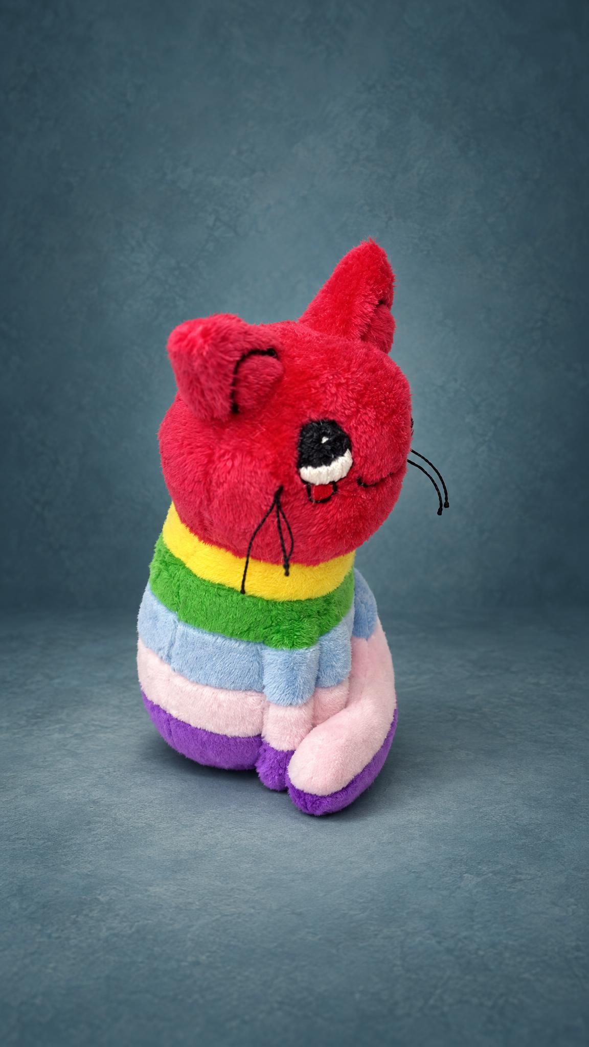 Rainbow kitty plush with embroidered upward-looking eyes, little tears and long whiskers, handmade to order