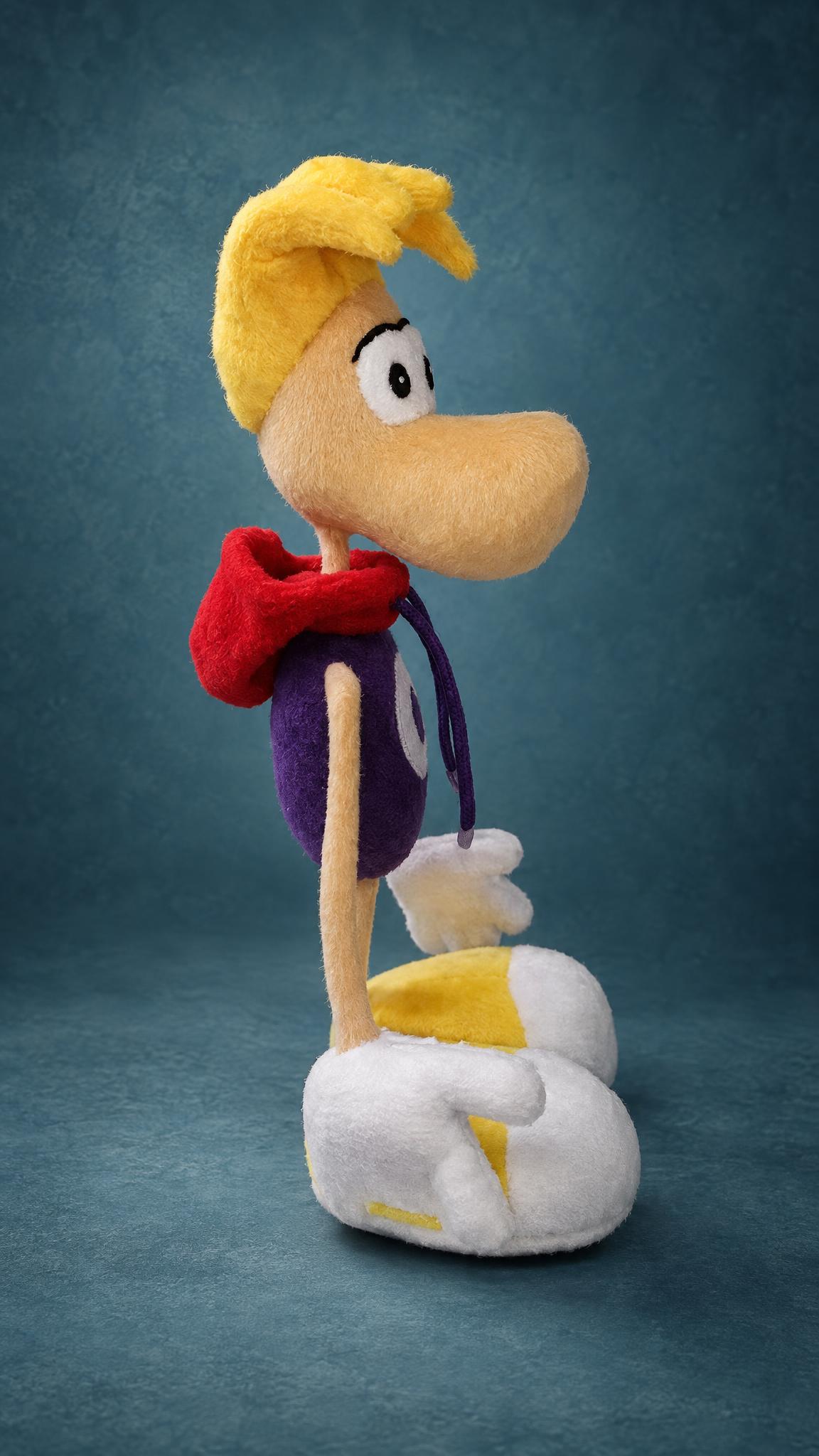 Handmade Rayman plush with a red hood, a yellow hair tuft and big yellow-and-white shoes, sewn to order