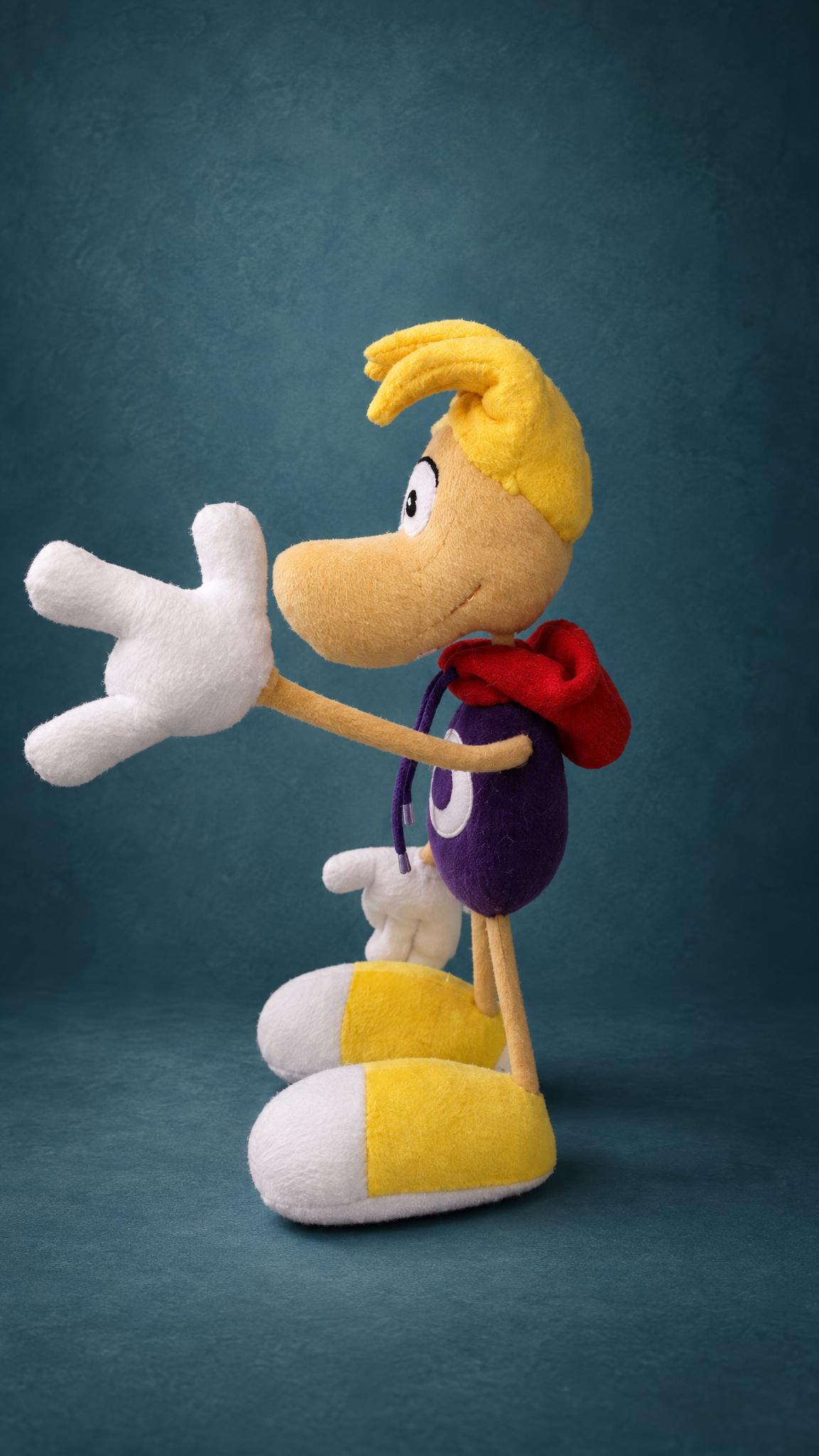 Custom Rayman soft toy waving a big white glove, with yellow hair and a red hood, handmade to order