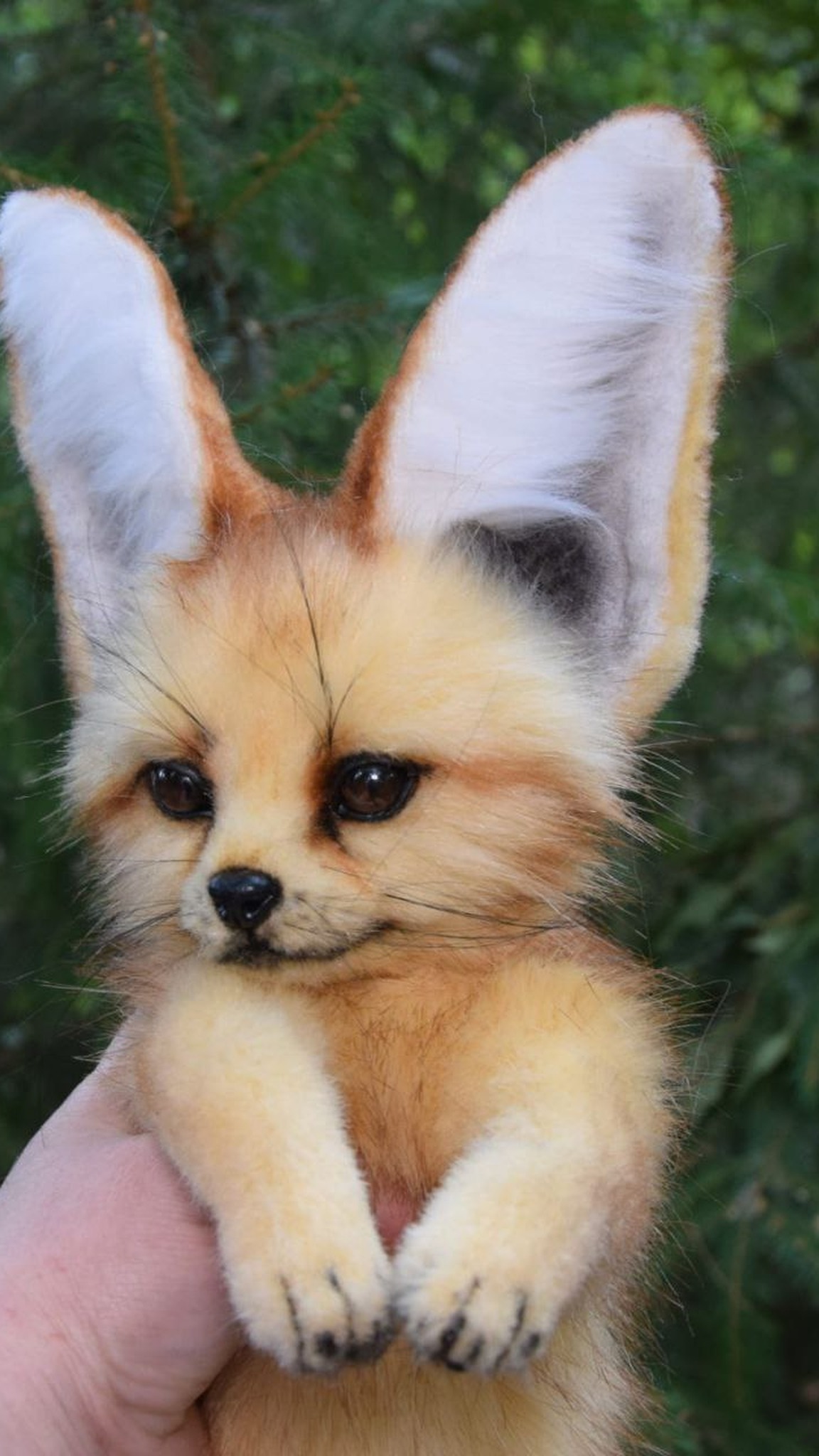 Realistic fennec plush held upright, cream paws and huge ears, a custom gift for an exotic animal lover