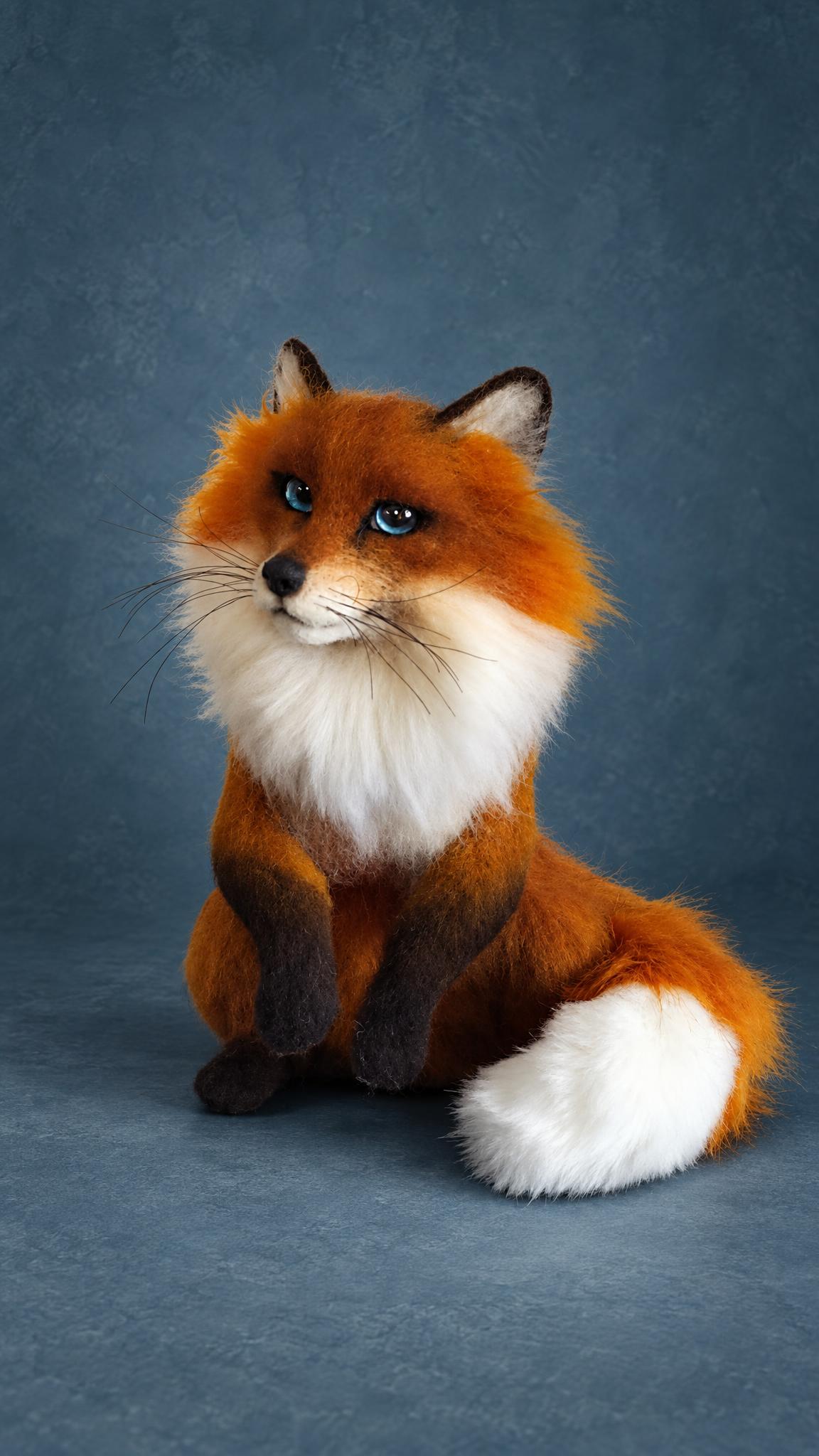 Realistic fox plush felted from wool to order: long dark whiskers, blue eyes and a bushy white-tipped tail