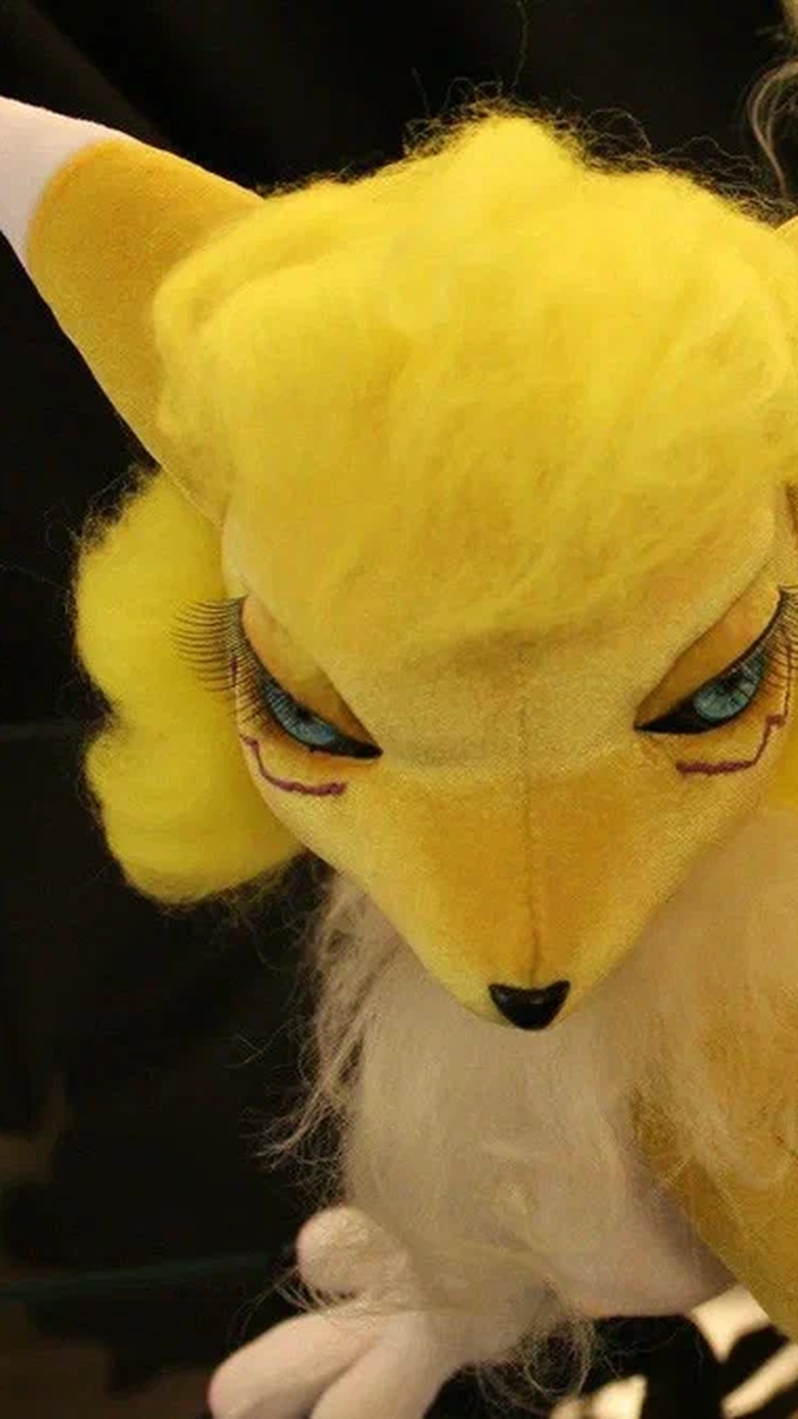 Renamon doll face with hand-painted blue eyes, long lashes and a yellow faux-fur mane, a custom Digimon art doll