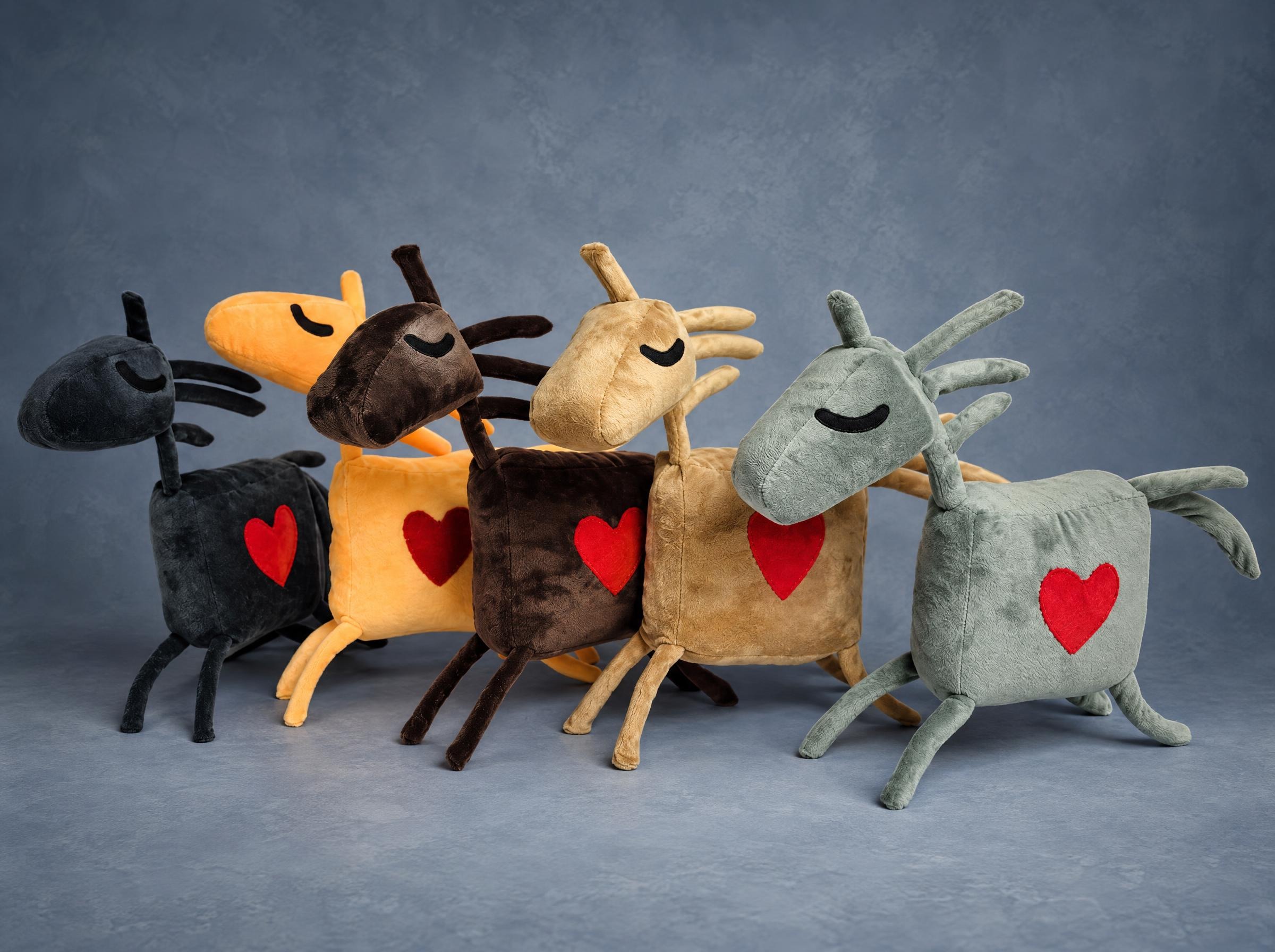 A batch of horse mascot plushes in five colours A batch of riding club horse mascot plushes in five colours, all with red hearts, made to order