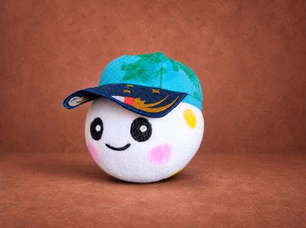 Rise plush from Artemis II, handmade to order: white moon with embroidered smile and a turquoise Earth cap