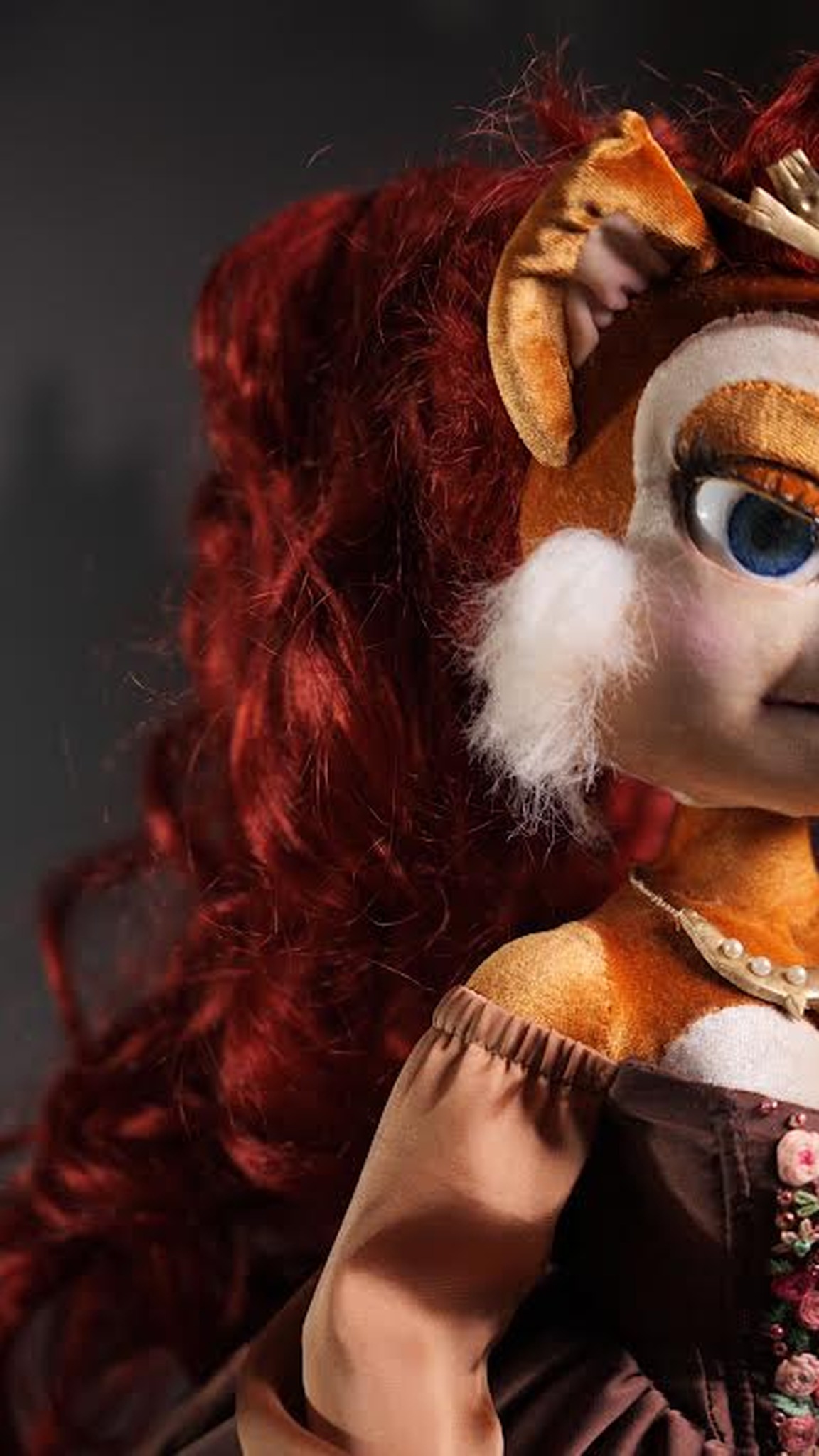 Sally Acorn doll with long dark red curls, a gold tiara and white cheek fur, a custom Sonic plush doll