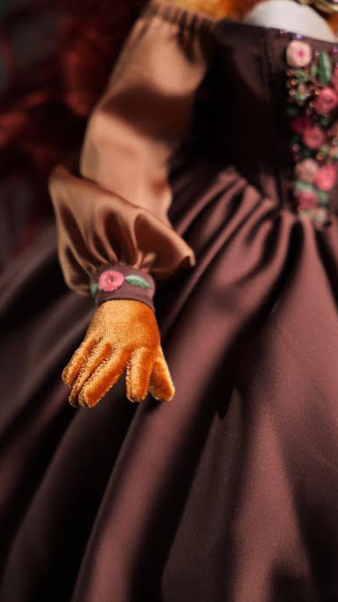 Sally Acorn doll hand in an orange glove with a rose-embroidered satin cuff, a custom Sonic doll made to order