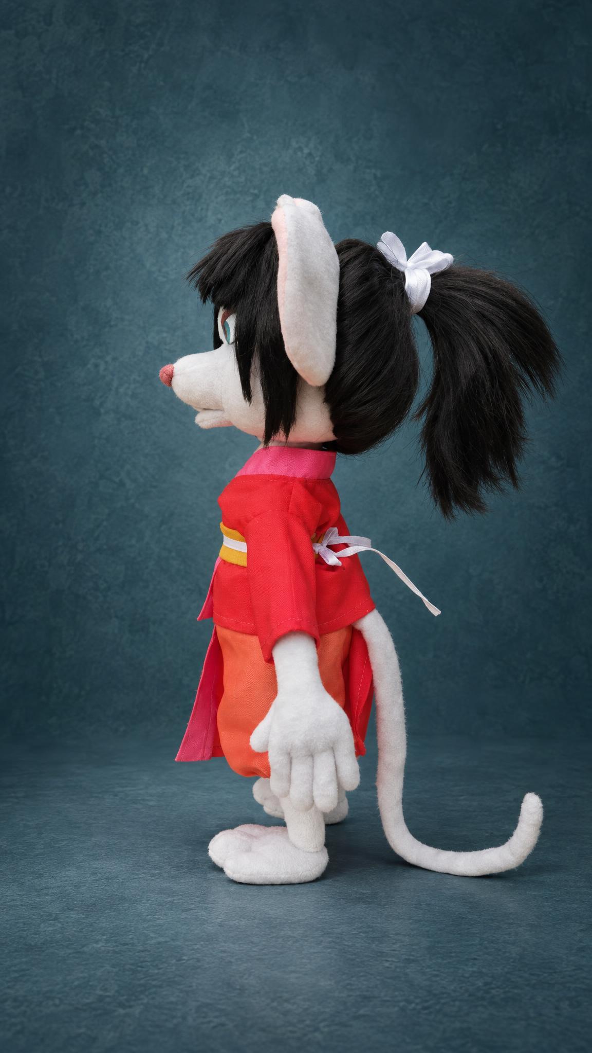 Custom samurai rat plush in profile with a red kimono, a black ponytail and a long tail, made to order
