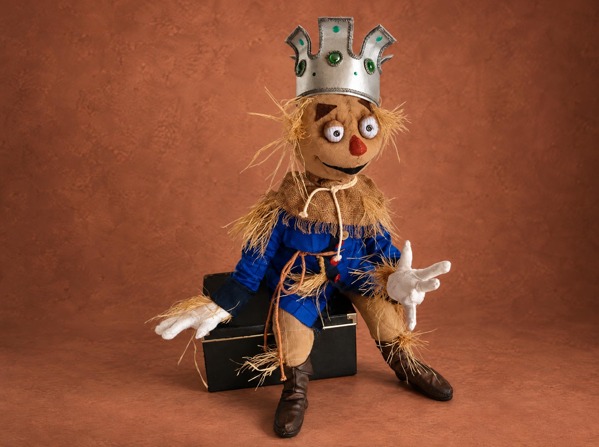 Scarecrow Doll with a Crown, Made to Order Handmade Scarecrow doll with a crown on a black box, straw at his wrists, a custom Oz doll made to order
