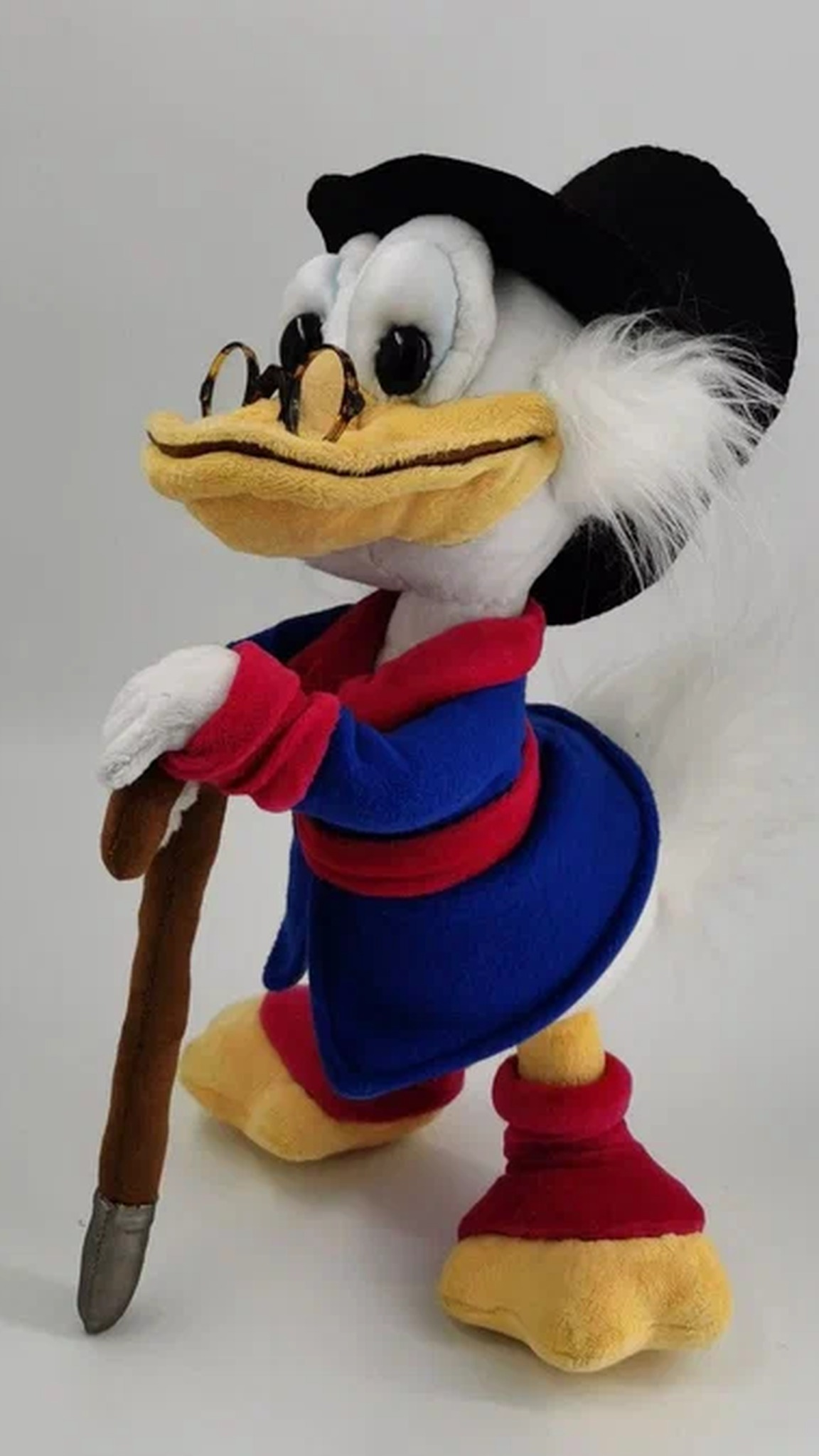 Scrooge McDuck plush with round glasses and white sideburns, hands on his cane, custom made to order