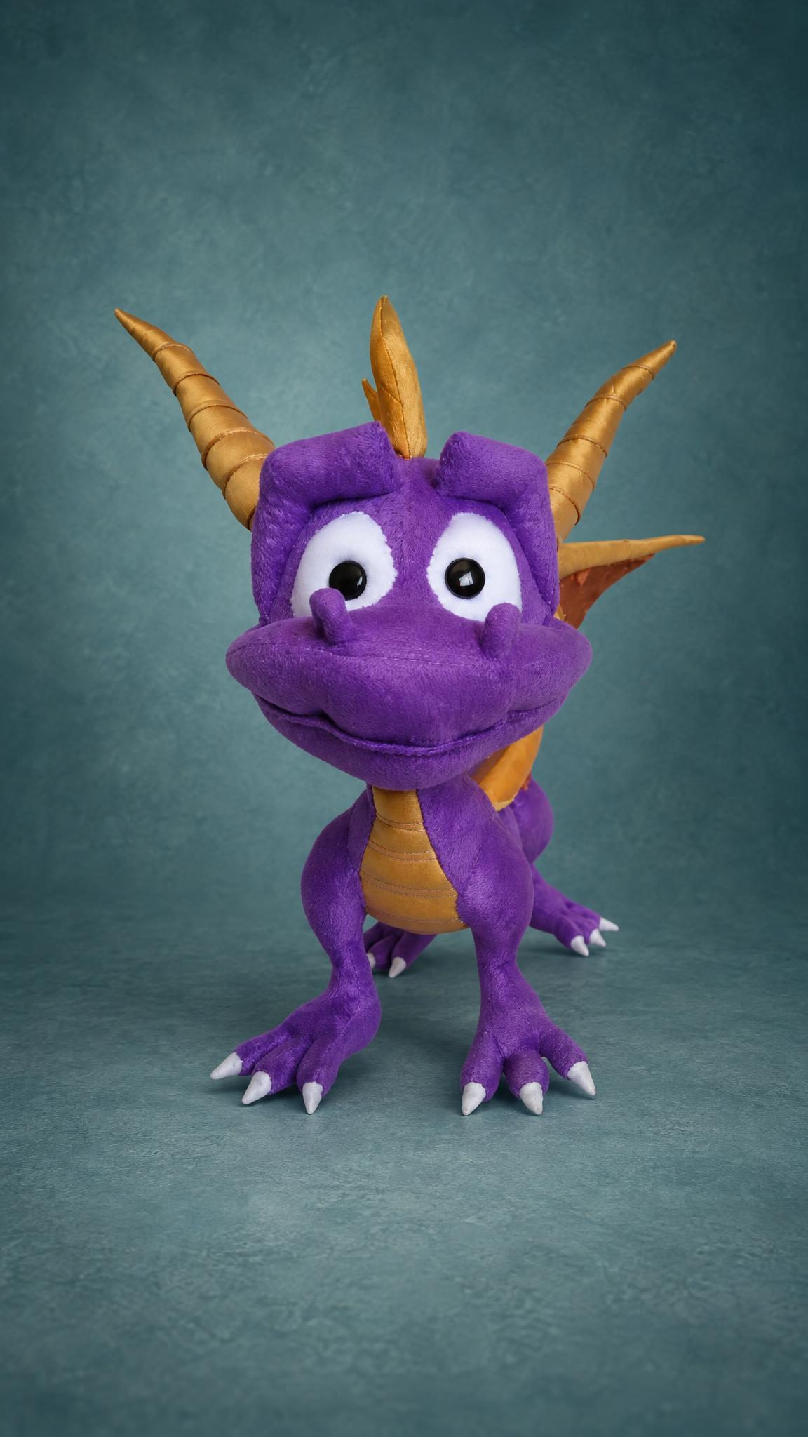 Custom Spyro the Dragon plush facing forward with big white eyes and gold horns, a handmade Spyro toy