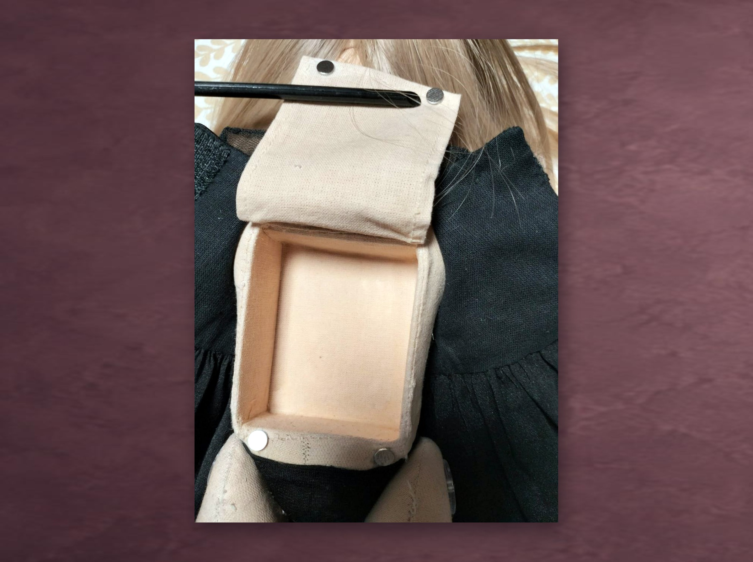 Sound Module Pocket in a Custom Talking Doll Sound module pocket in a custom talking doll: fabric compartment with a lid on the witch doll's back, made to order
