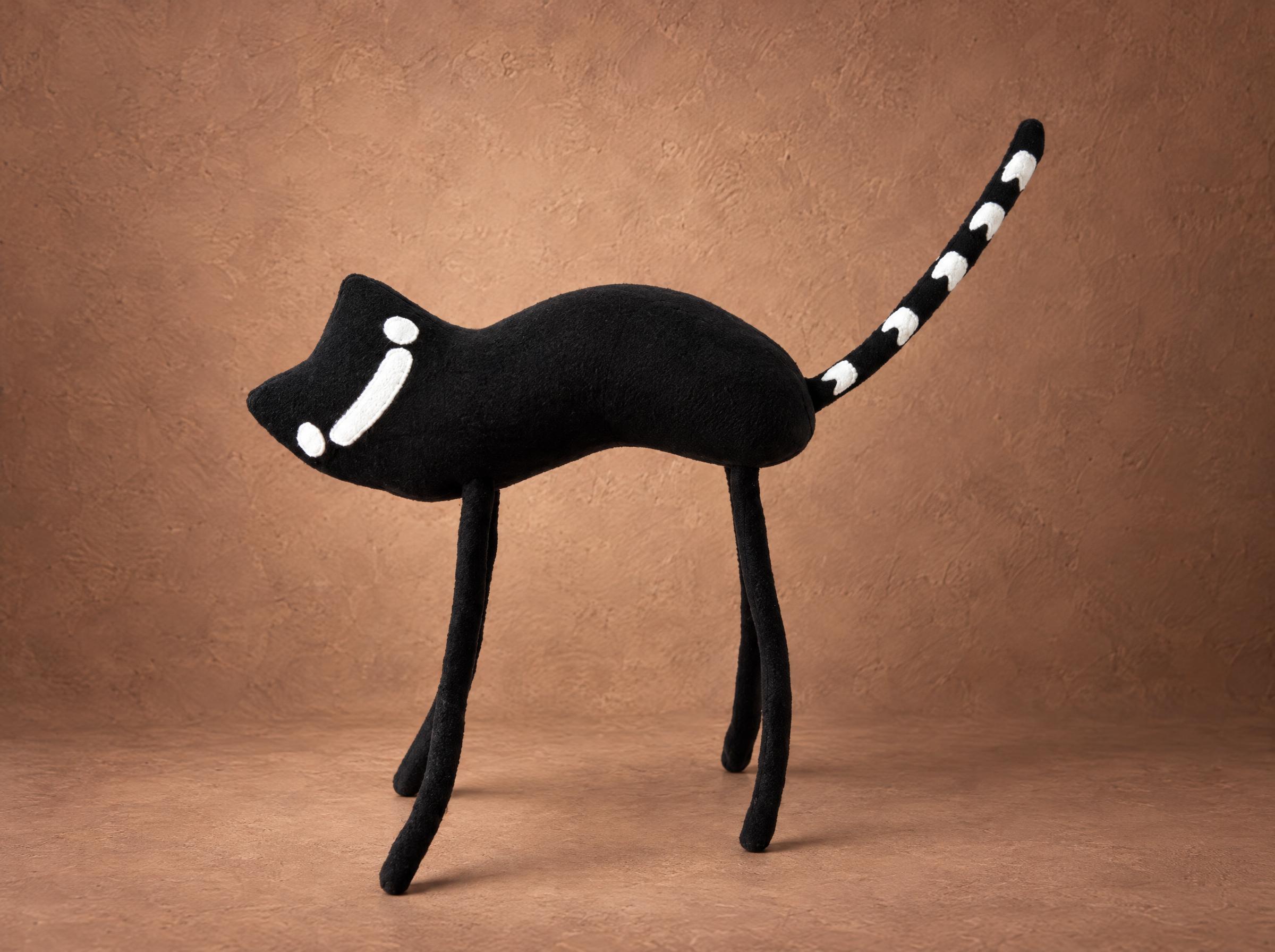 Thin black cat plush sewn to order from an illustration: long legs, a white line eye and a ringed tail