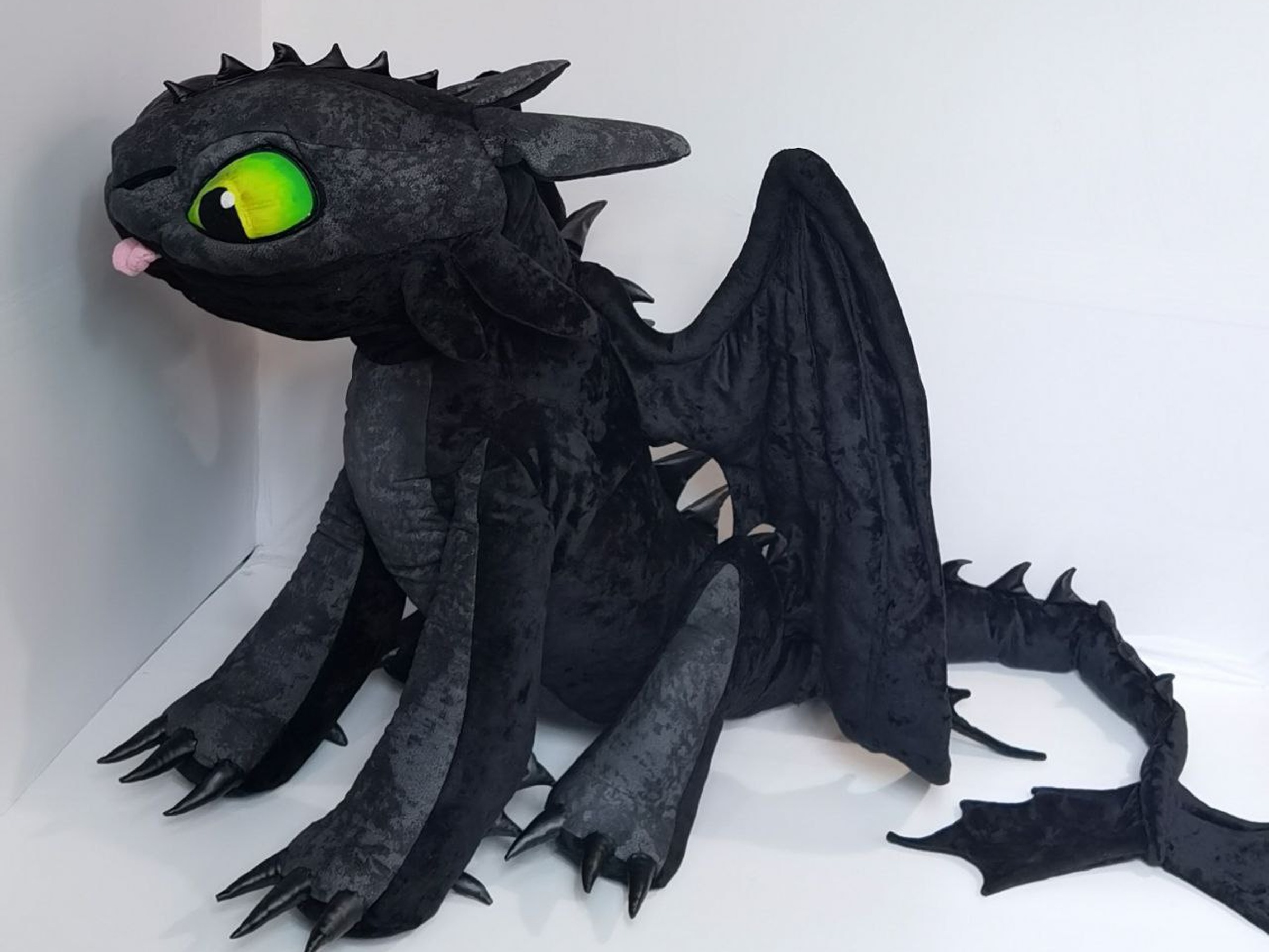 Toothless stuffed animal crouching, handmade to order Toothless stuffed animal crouching with his tongue out and green eyes, a custom HTTYD plush sewn by hand