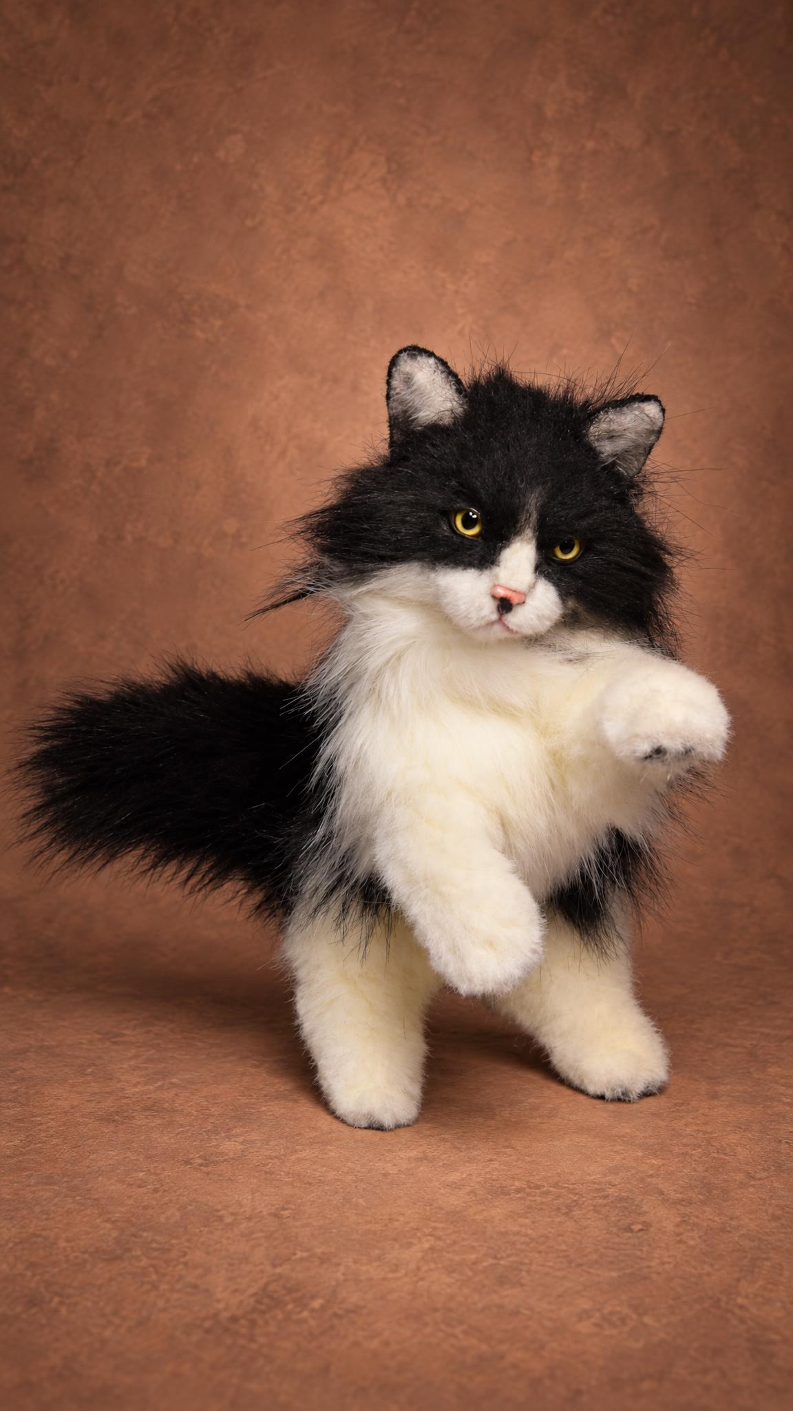 Custom tuxedo cat plush sitting up with a paw raised, long black and white faux fur, made to order