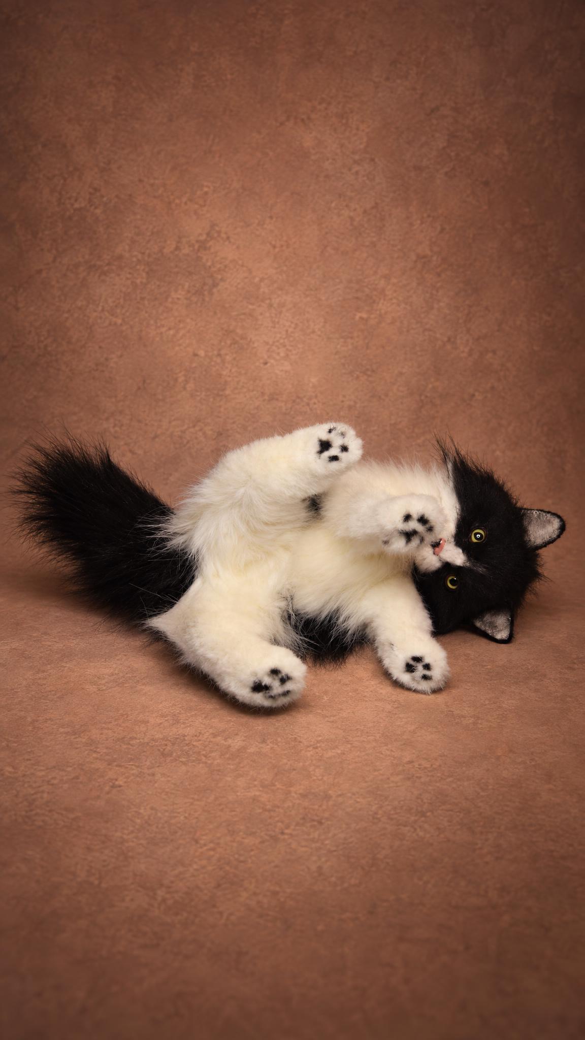 Black and white cat stuffed animal rolling on its back with paws up, handmade to order from photos