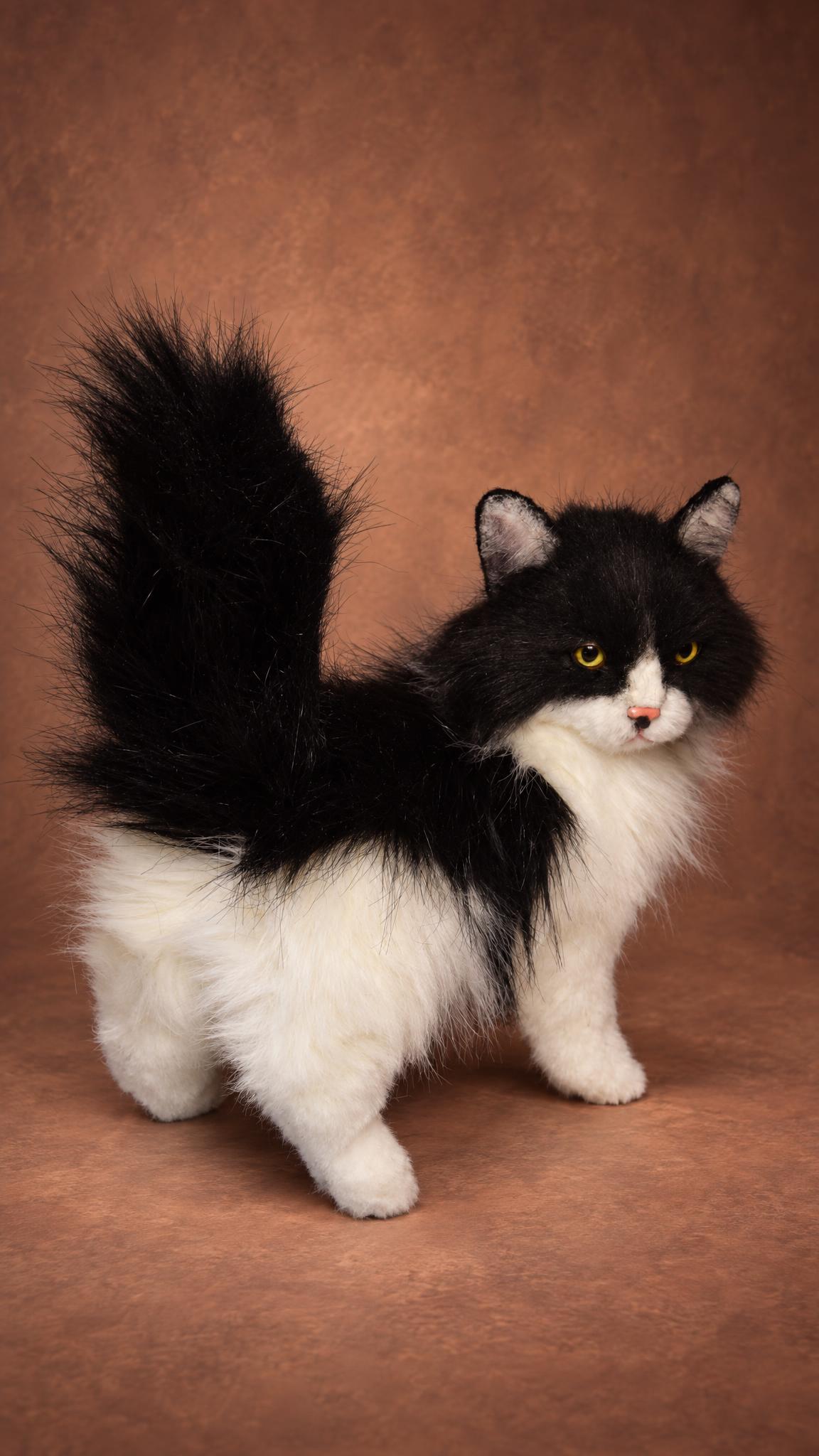 Black and white cat plush with a raised fluffy tail, custom made to order from pet photos