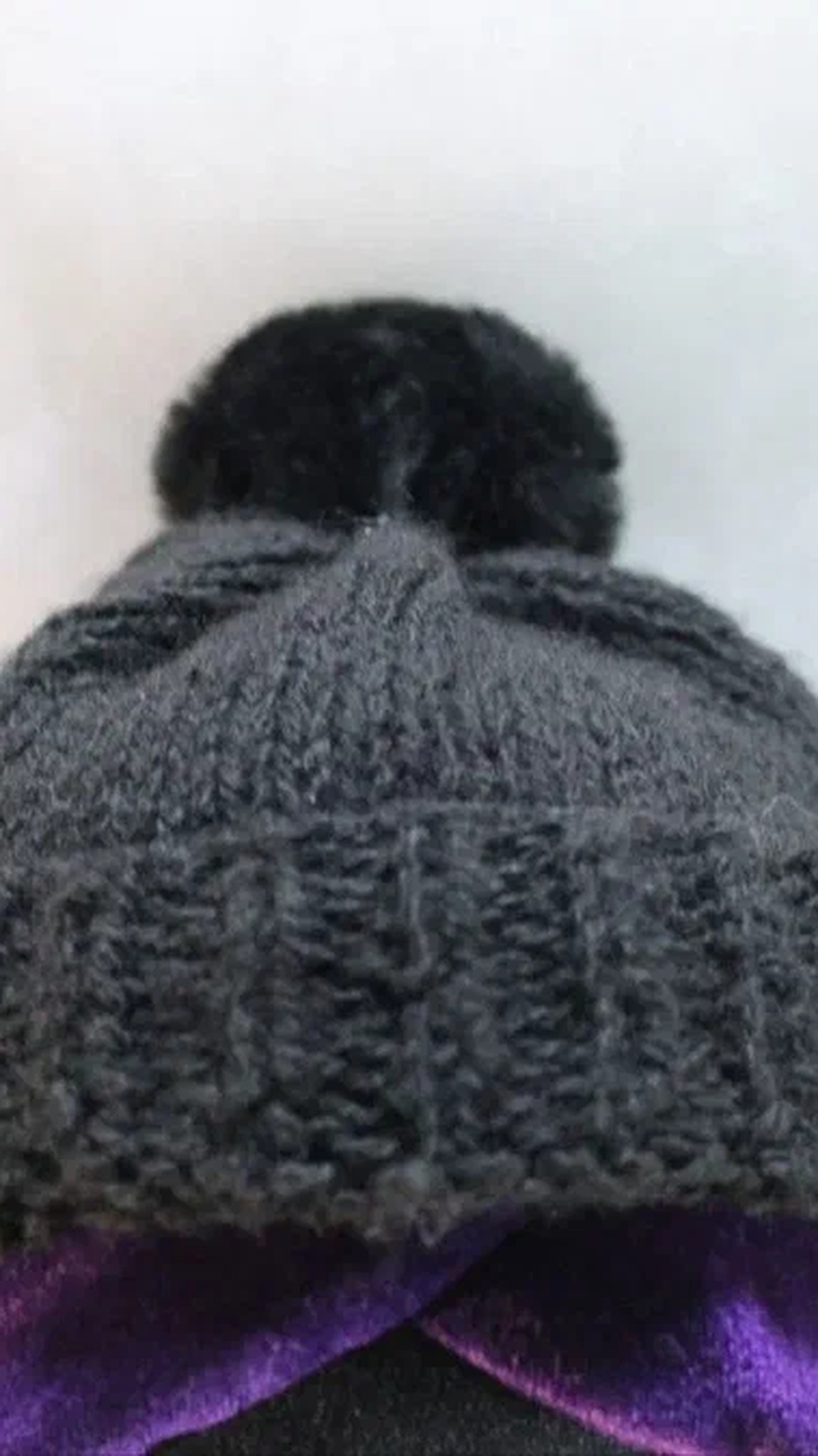 Uzi plush grey knitted beanie with a pompom over purple hair, a Murder Drones character made to order