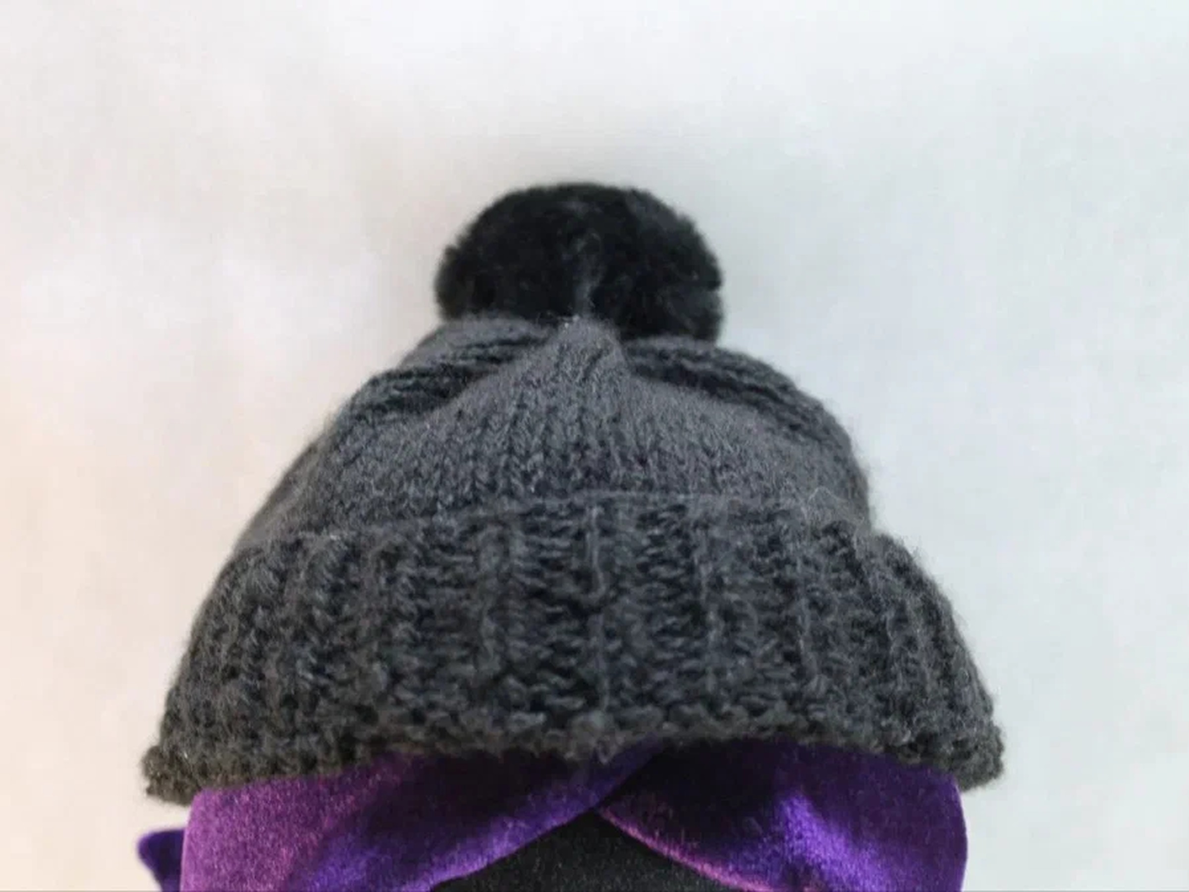 Uzi plush, the knitted beanie Uzi plush grey knitted beanie with a pompom over purple hair, a Murder Drones character made to order