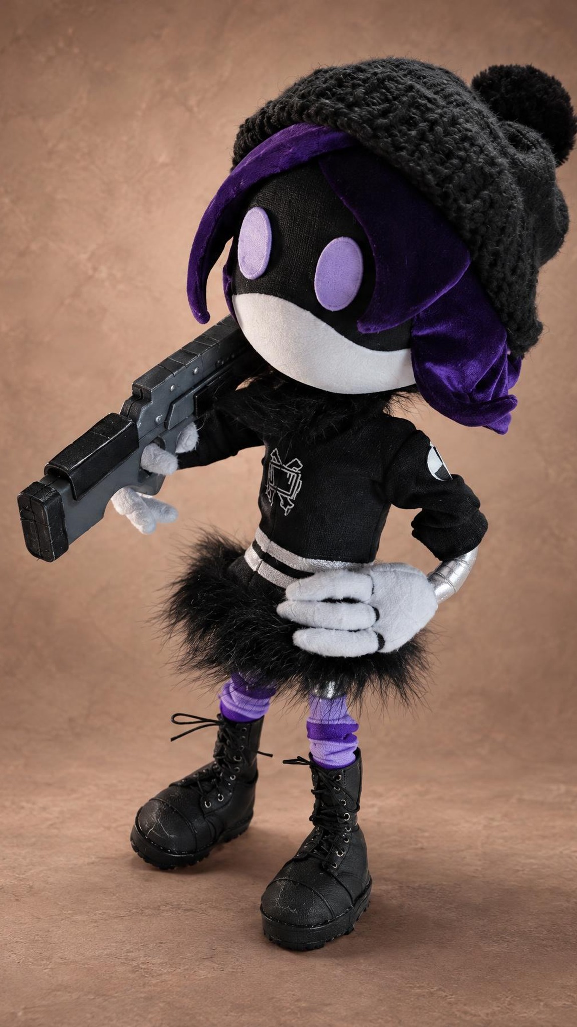 Uzi plush aiming her railgun, purple hair and grey beanie, a Murder Drones character sewn to order