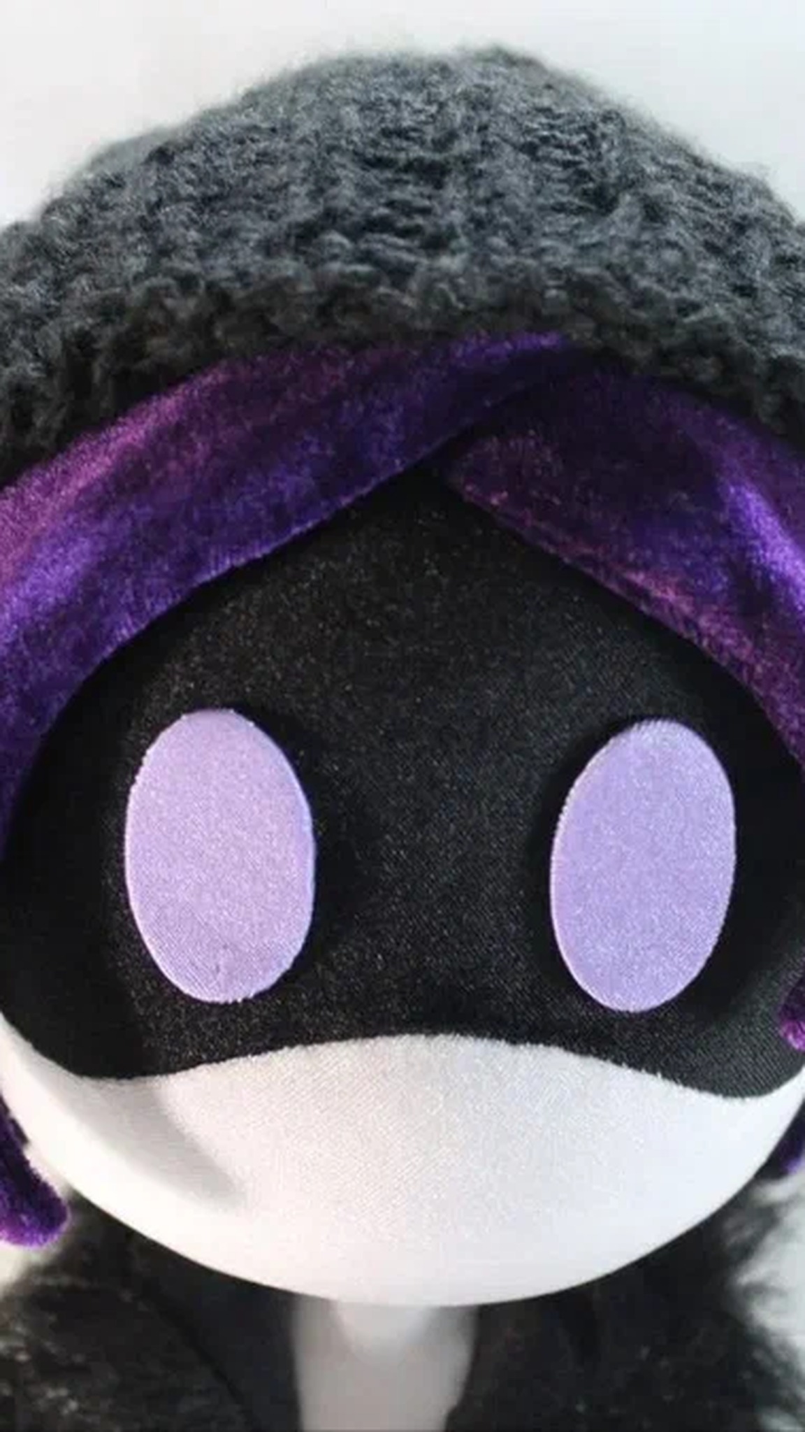 Uzi plush visor face with purple eyes under a grey beanie and purple hair, a Murder Drones doll made to order