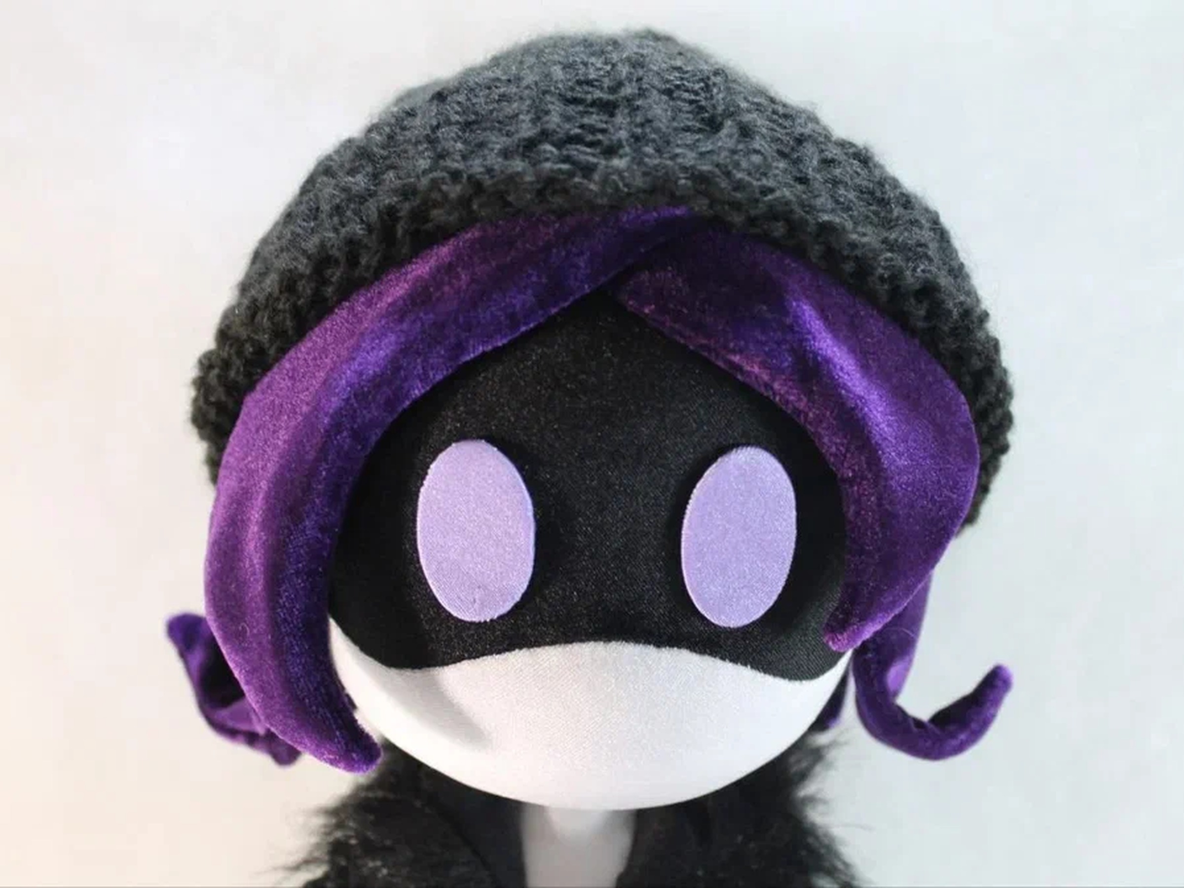 Uzi plush, visor face and purple eyes Uzi plush visor face with purple eyes under a grey beanie and purple hair, a Murder Drones doll made to order