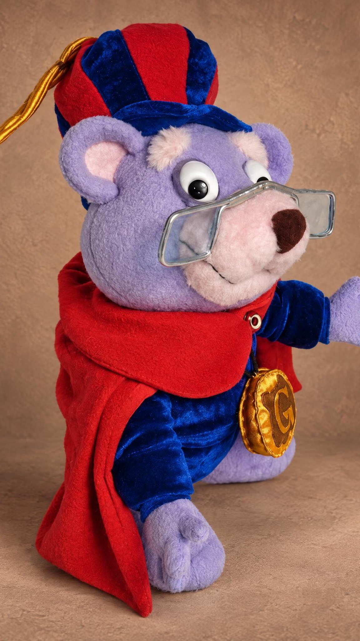 Zummi Gummi plush waving, blue velvet cape with a red lining and the G medallion, a Gummi Bears toy made to order