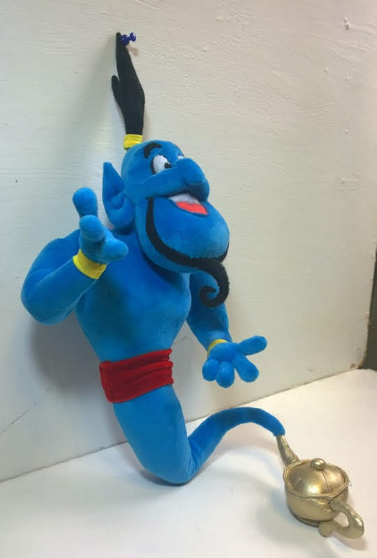 Aladdin Genie plush with a curled goatee Aladdin Genie plush with a big grin, curled black goatee and red sash, golden lamp at the tail tip, custom made